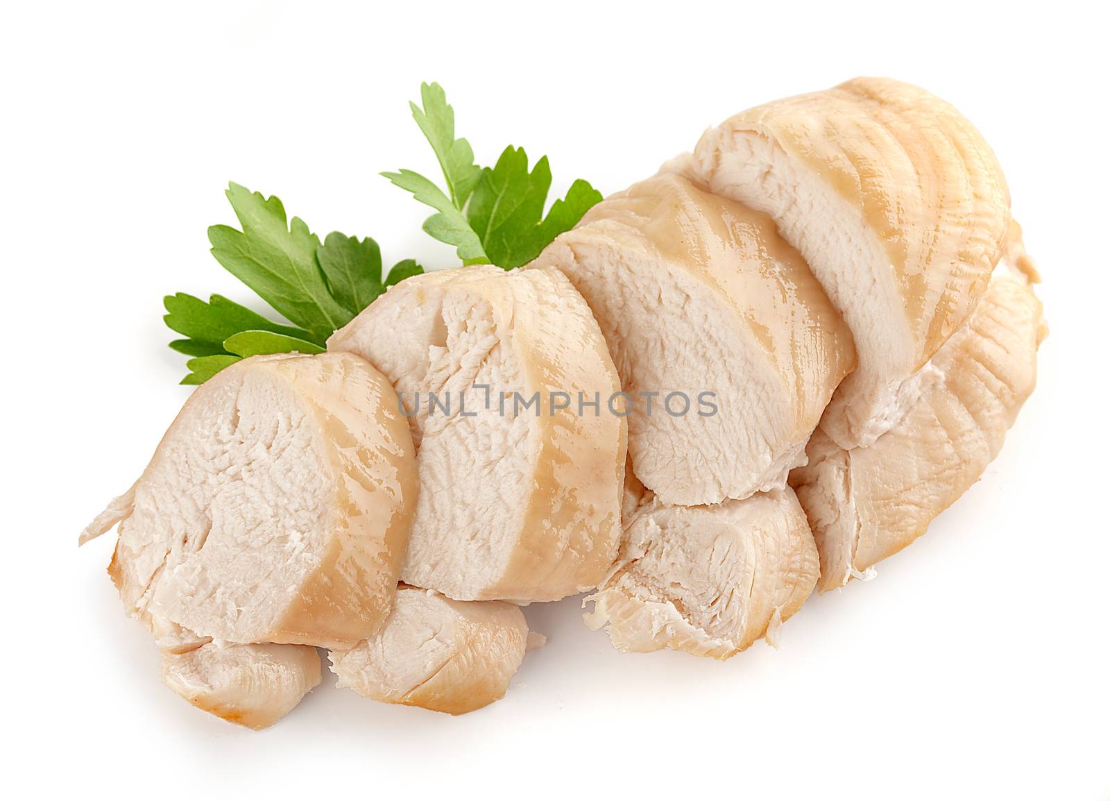 Isolated backed chicken fillet with green leaves of parsley
