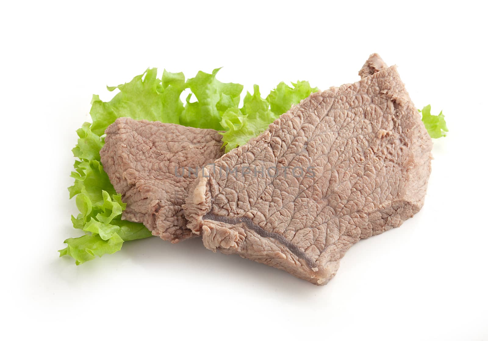 Isolated cooked beef and fresh green lettuce