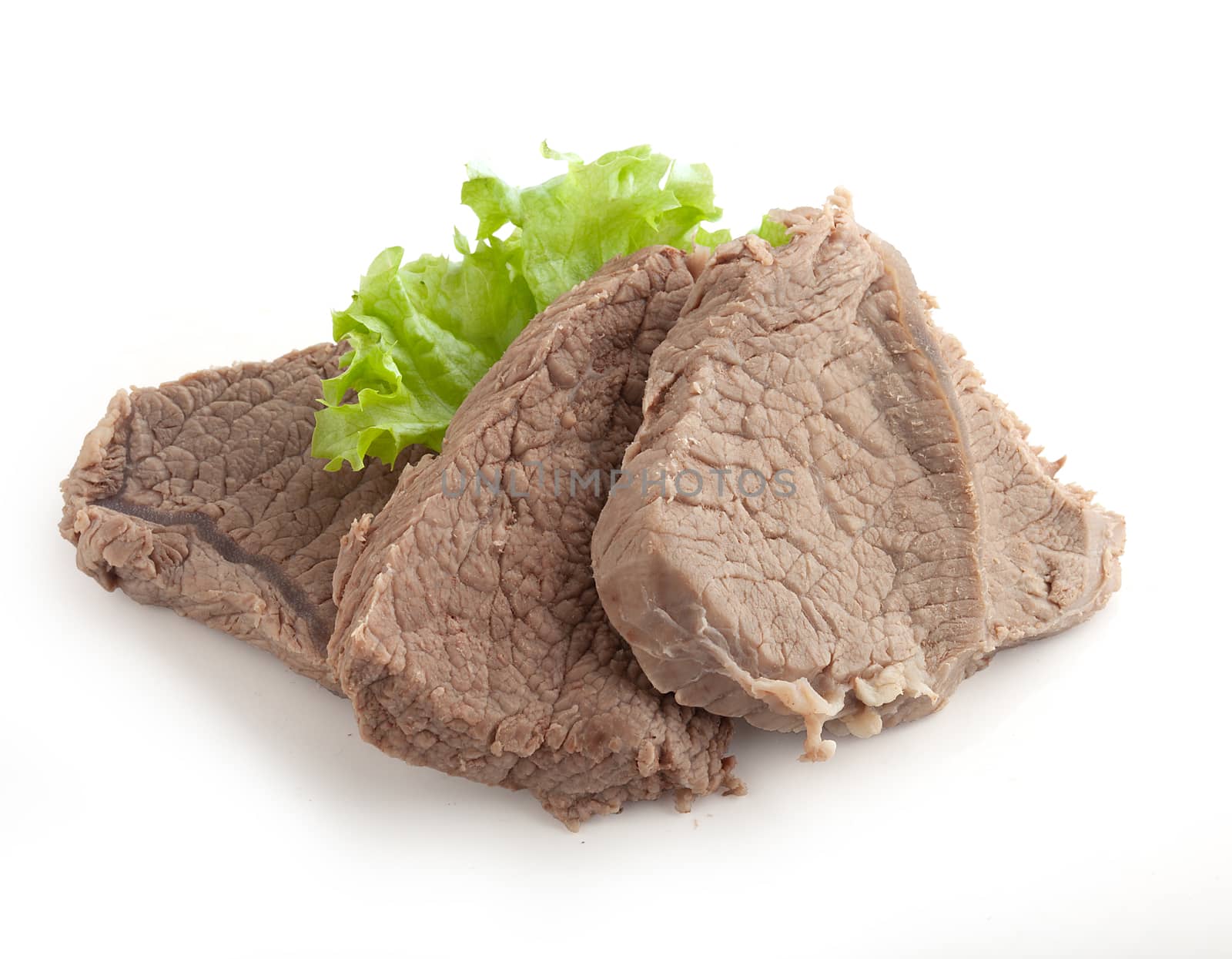 Isolated cooked beef and fresh green lettuce