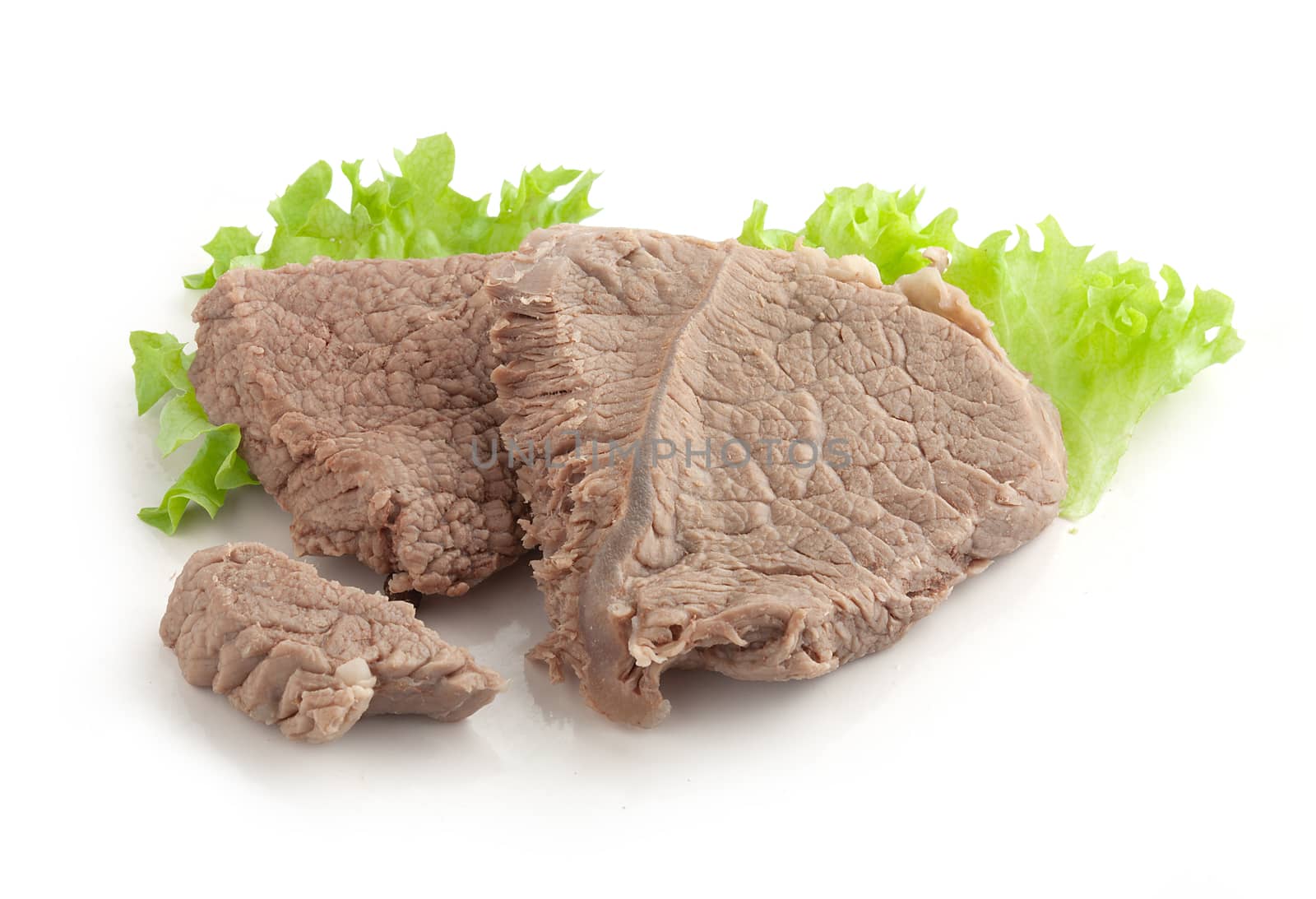 Isolated cooked beef and fresh green lettuce