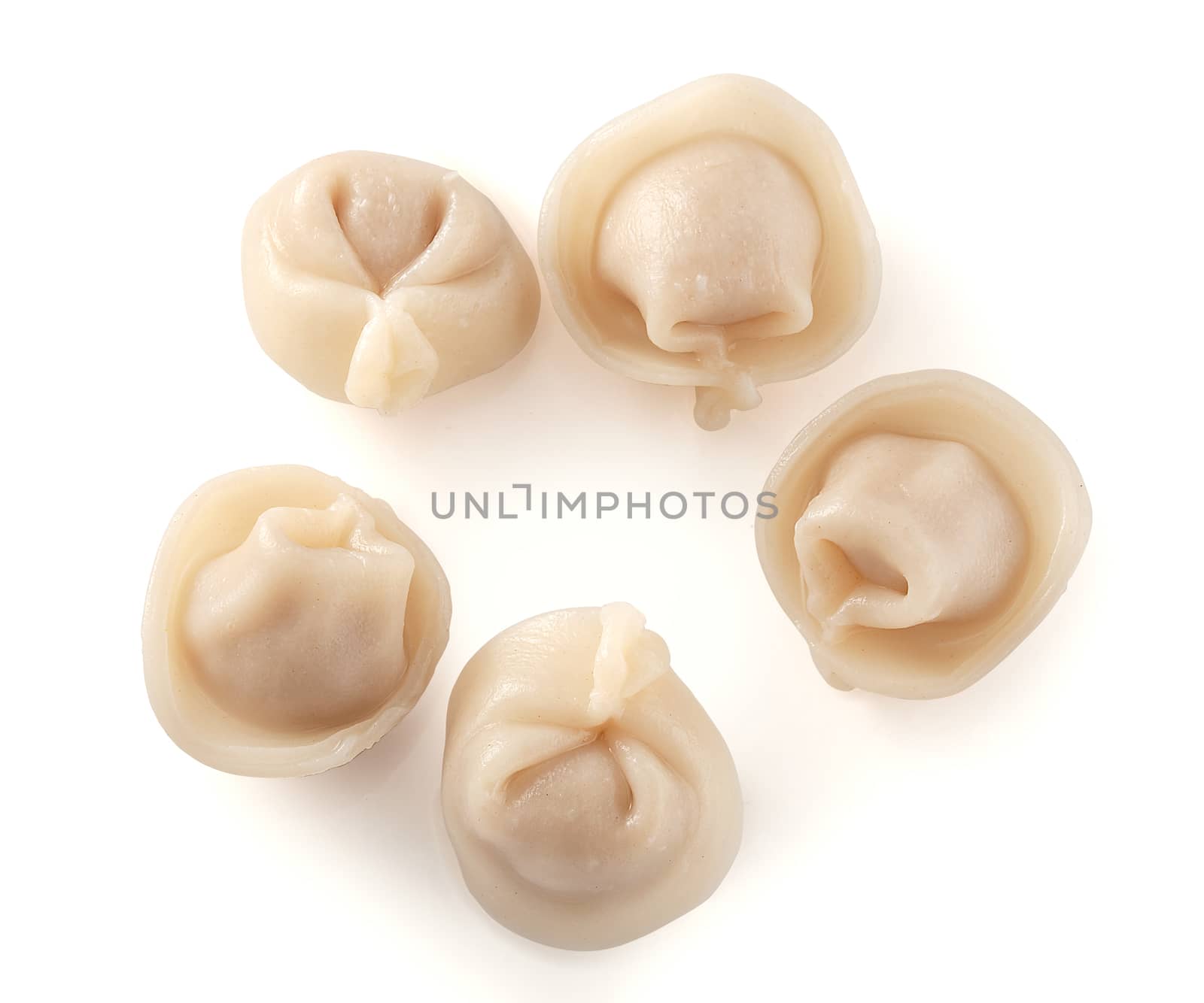 Five isolated prepared dumplings on the white background