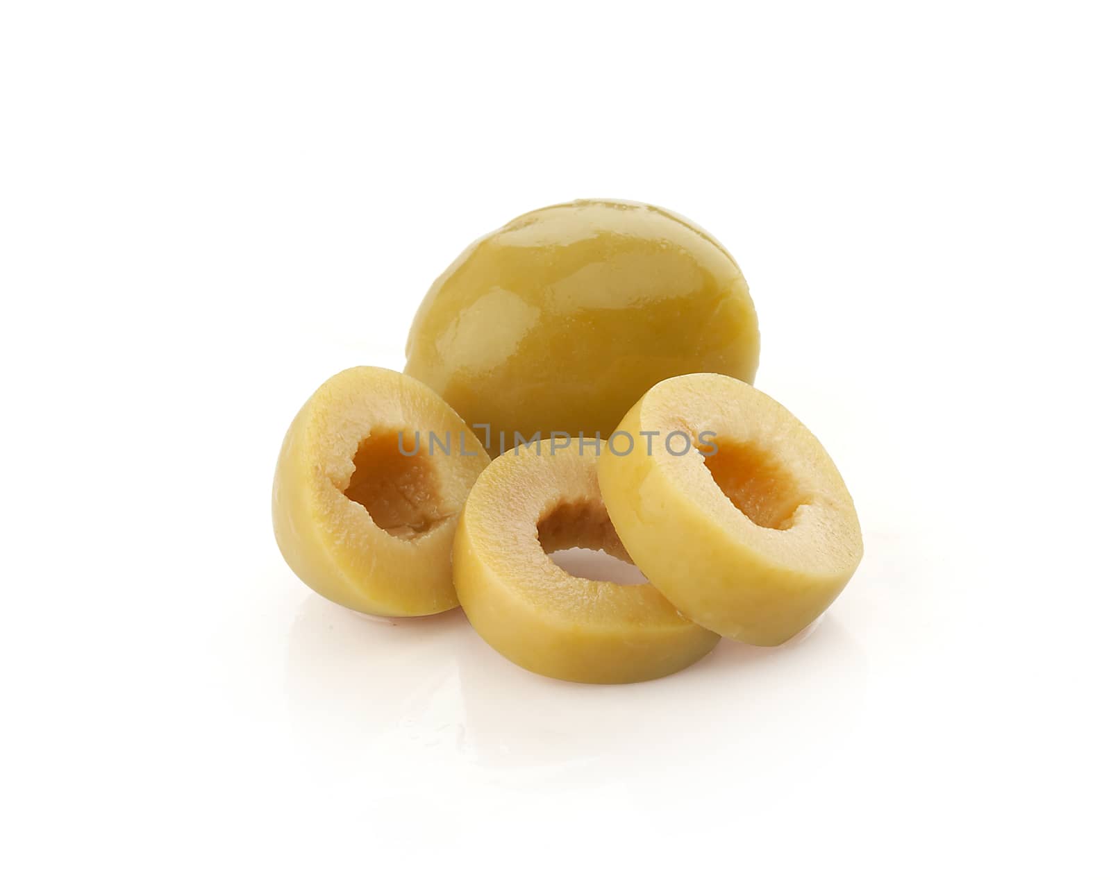 Isolated slices of green olives on the white background