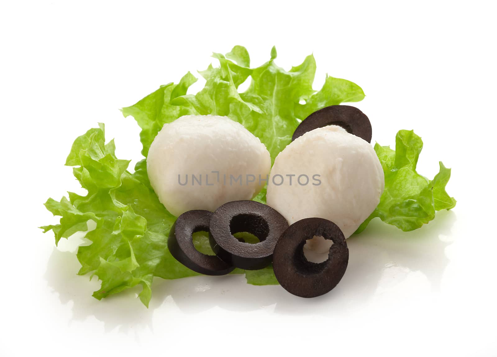 Some small balls of mozzarella with black olives and fresh green lettuce