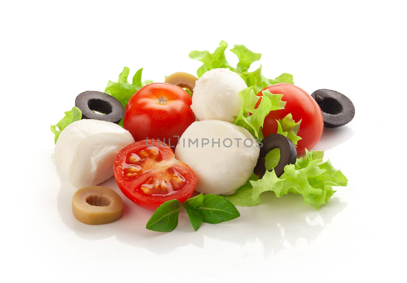 Some balls of mozzarella with tomato cherry, olives and fresh green lettuce