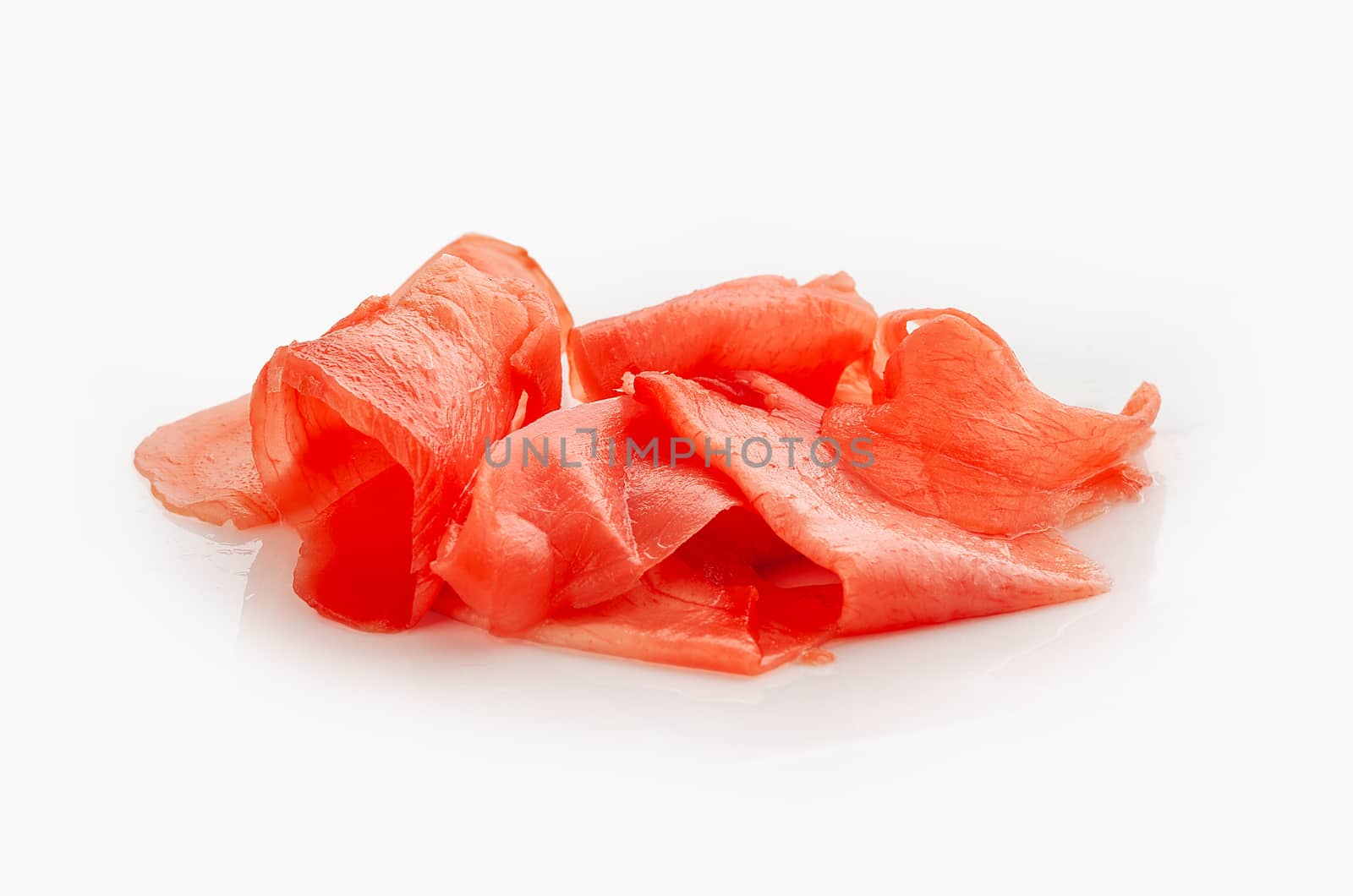 Isolated handul of red pickled ginger on the white