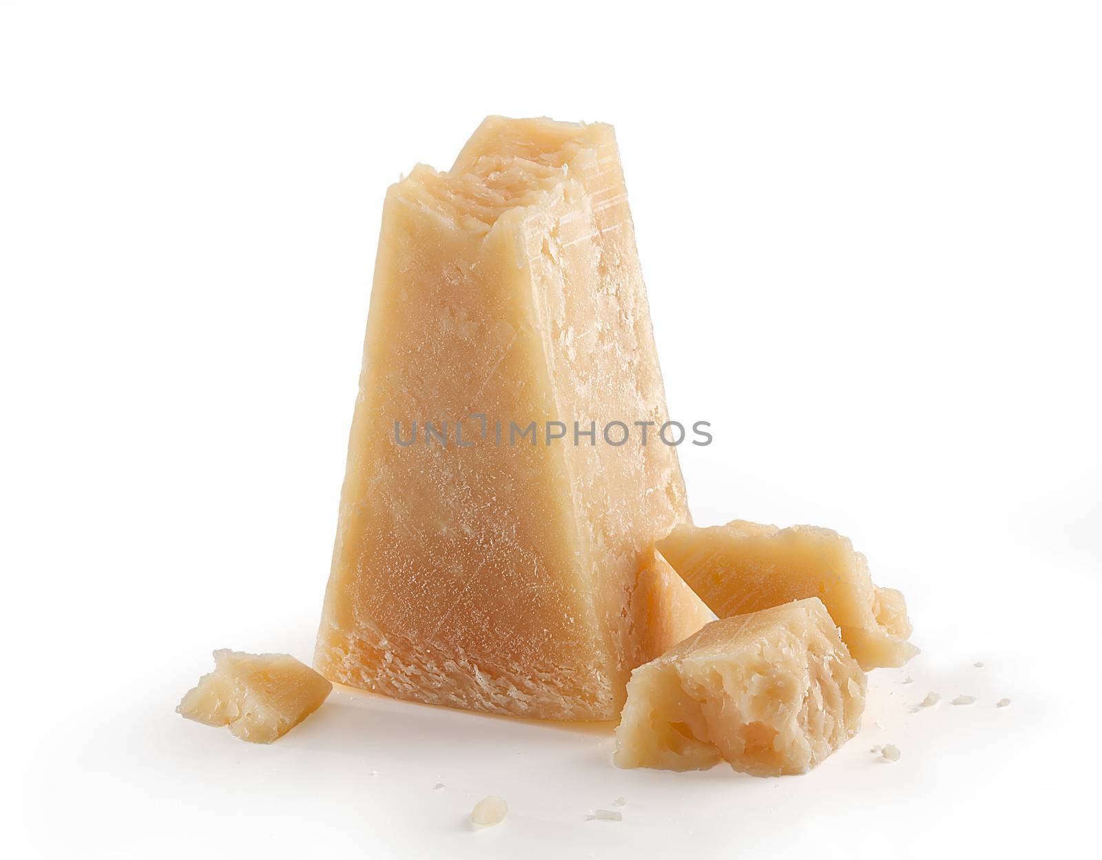 Isolated pieces of parmesan cheese on the white background