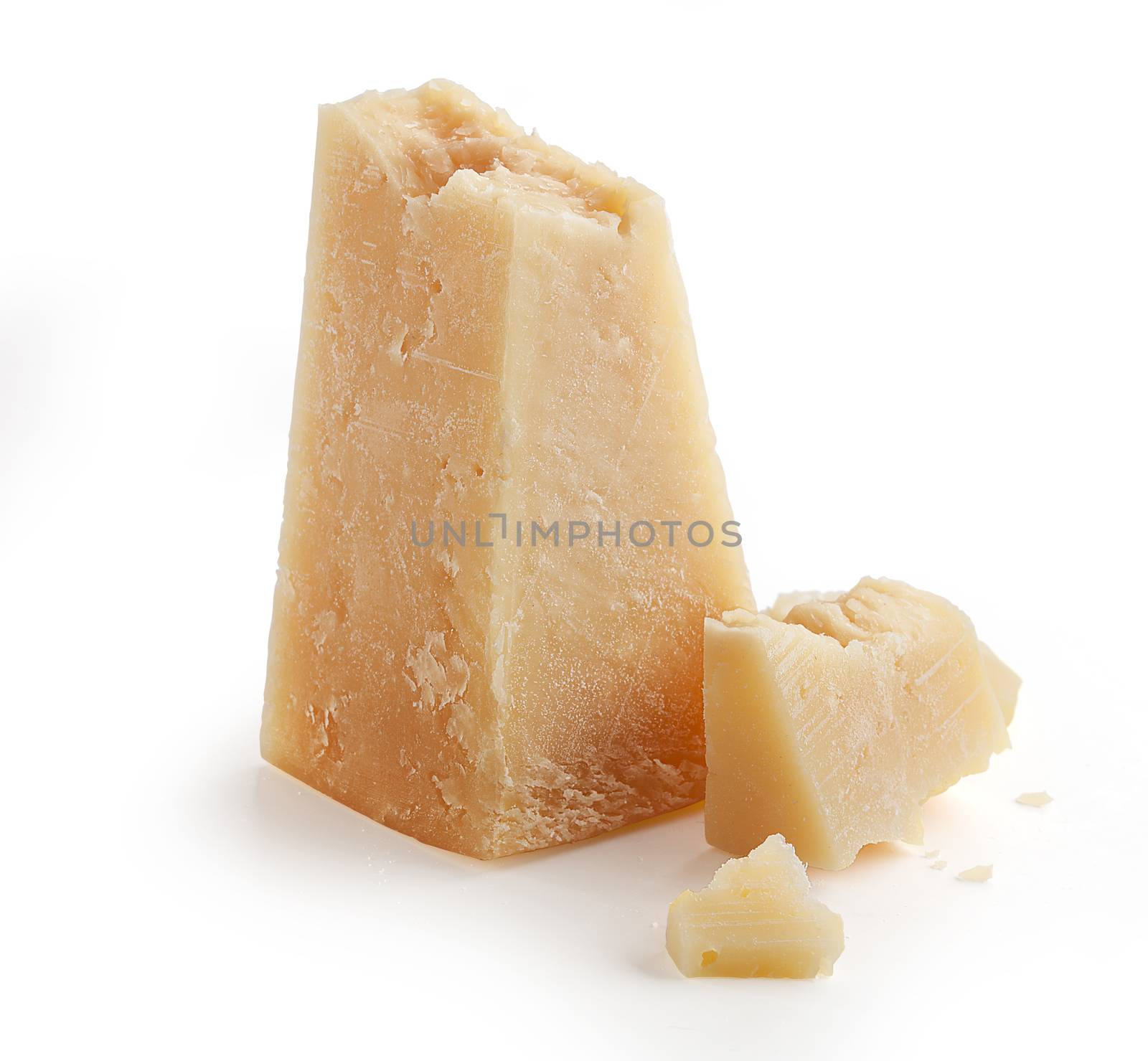 Isolated pieces of parmesan cheese on the white background