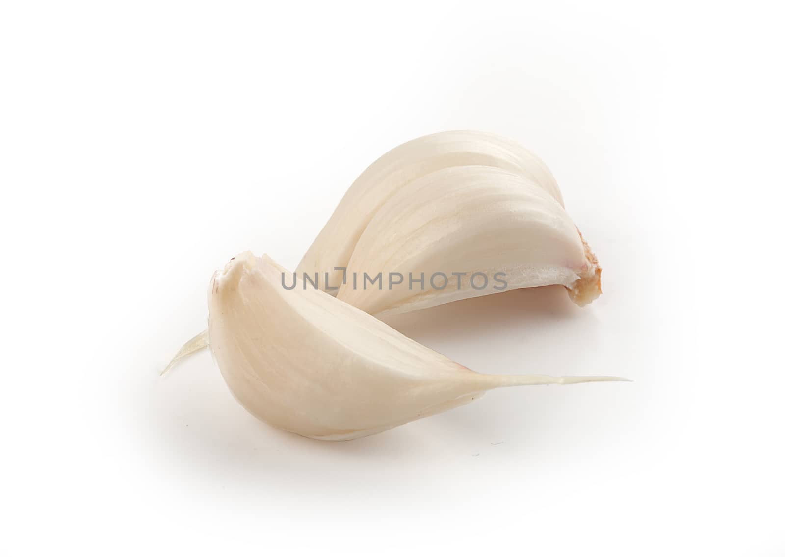 Isolated two cloves of young garlic on the white background