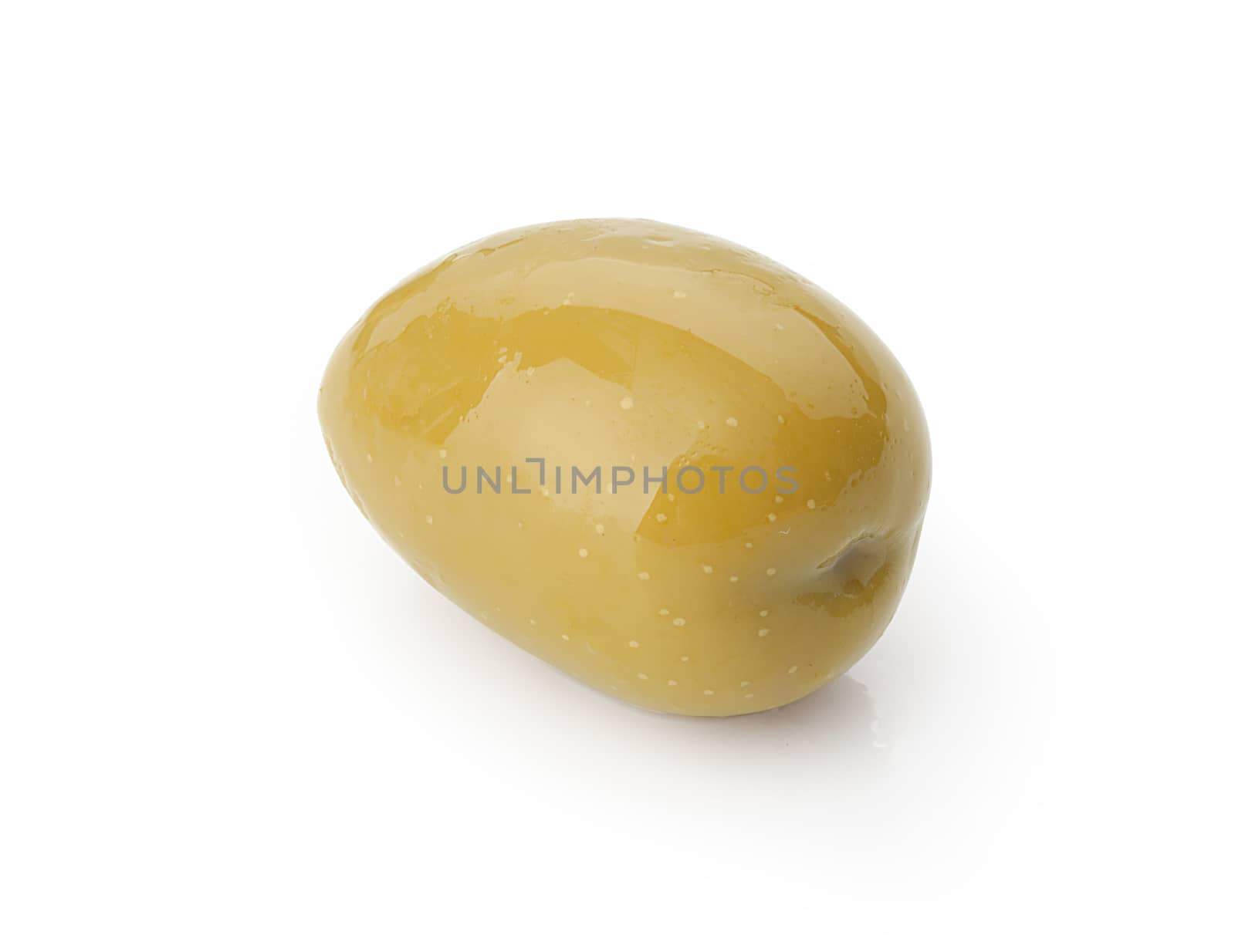 Isolated marinated green olive wit the pit on the white background