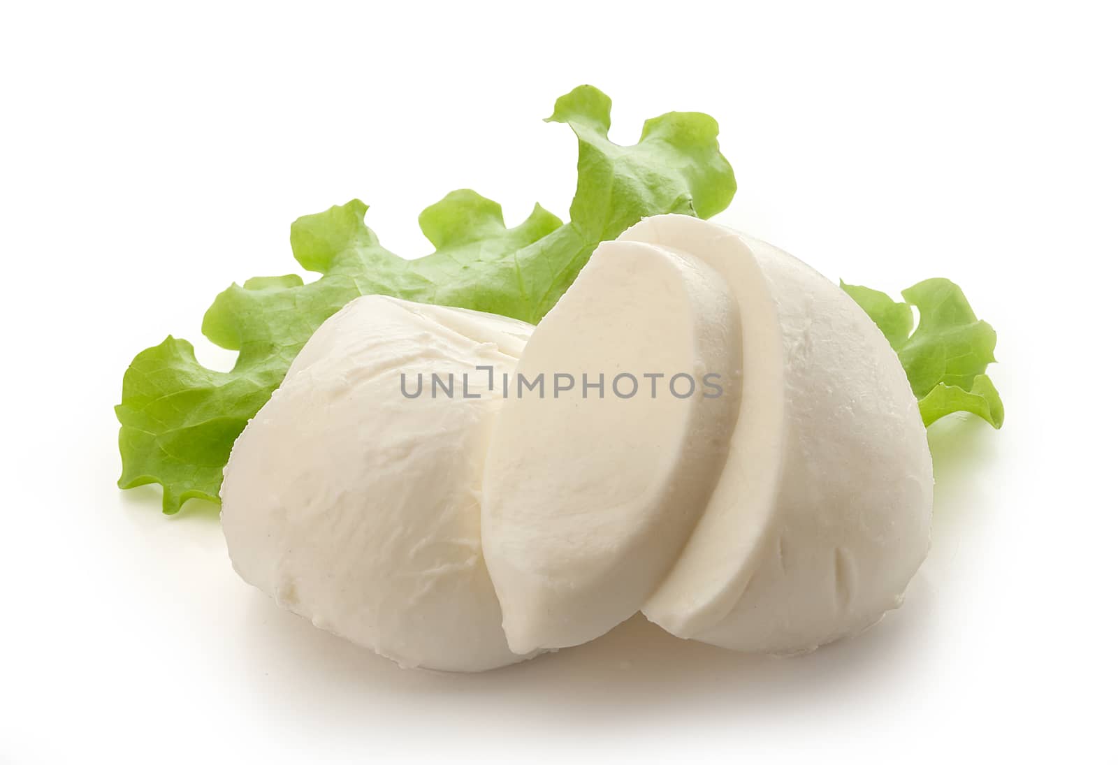 Two mozzarella balls with fresh green lettuce on the white