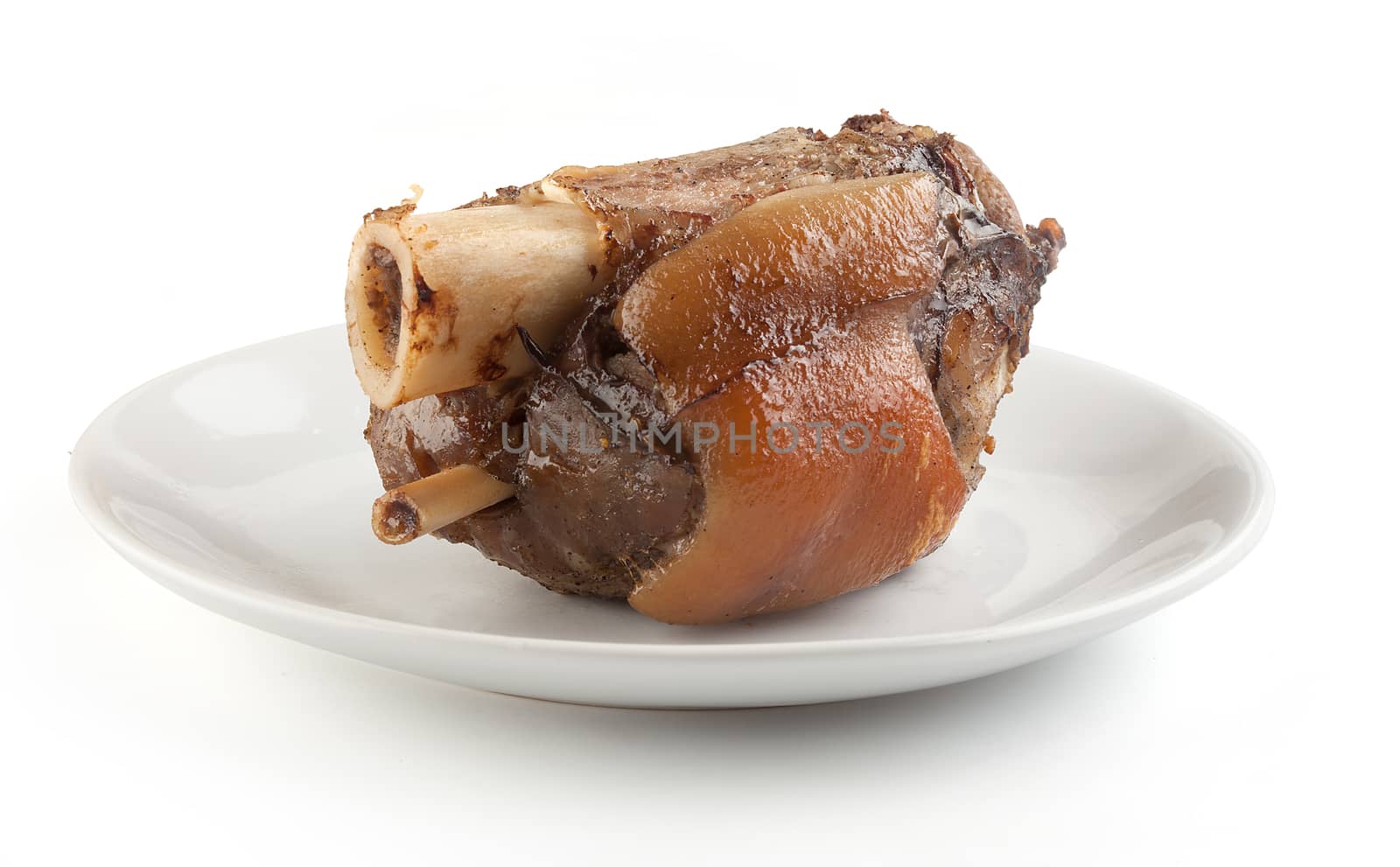 Roasted pork knuckle on the white plate