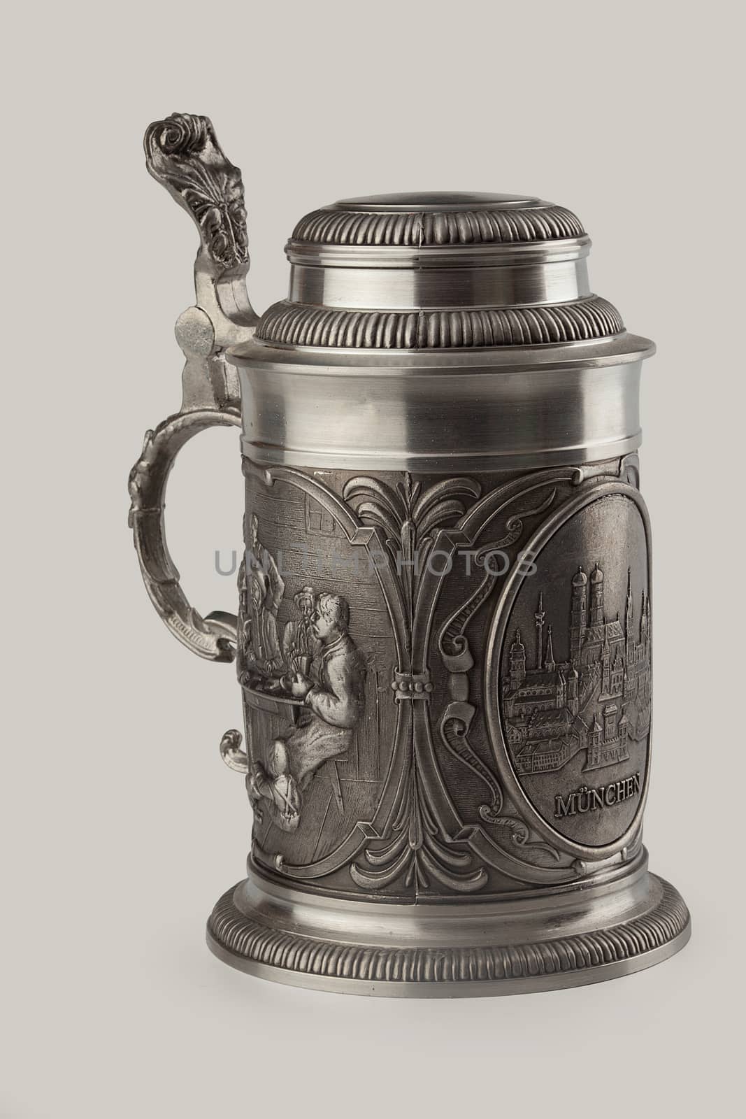 Decorated metal beer mug on the white