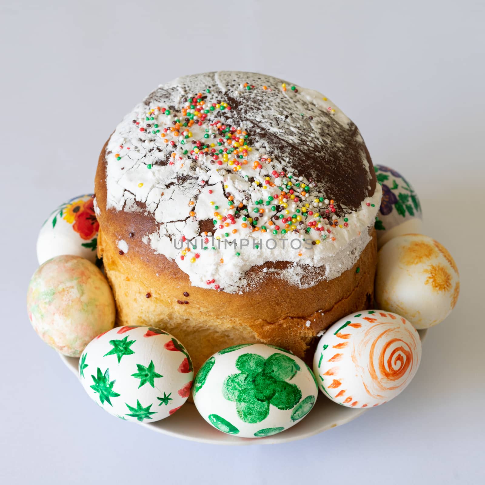 beautiful festive Easter cake with colorful eggs on the plate