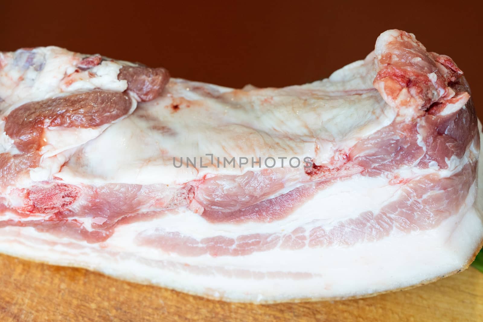 a large piece of raw pork fat germinated with meat