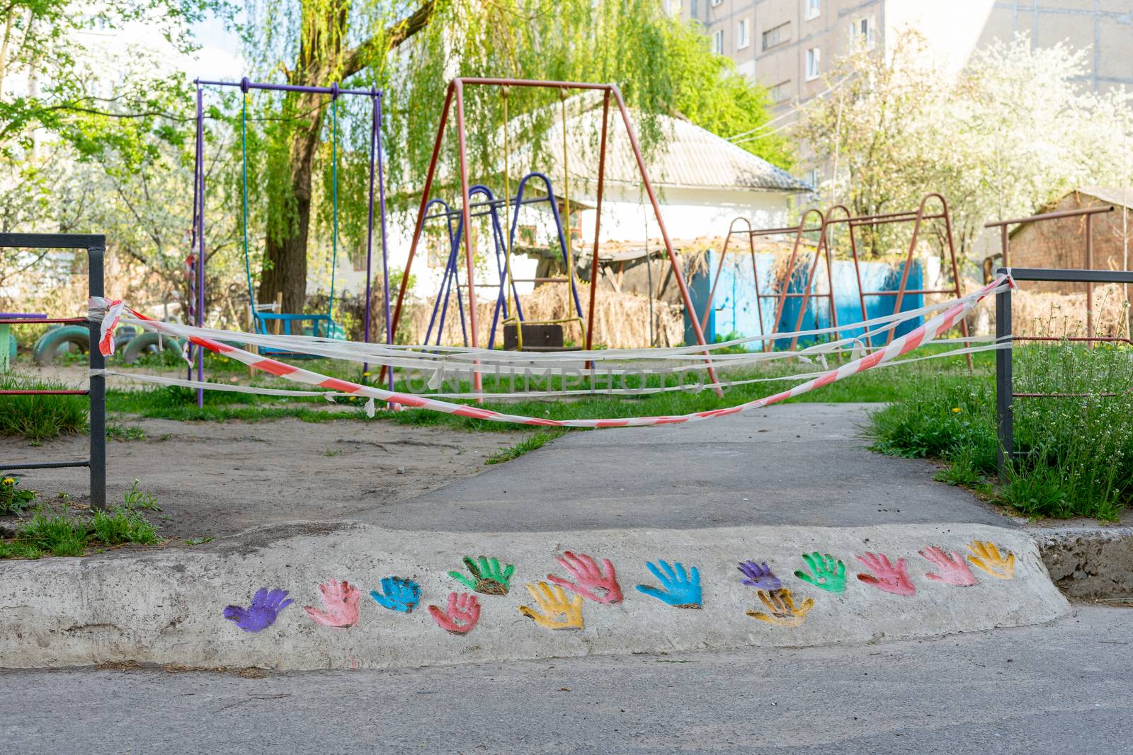 the playground is closed by a quarantine tape during coronavirus by Serhii_Voroshchuk