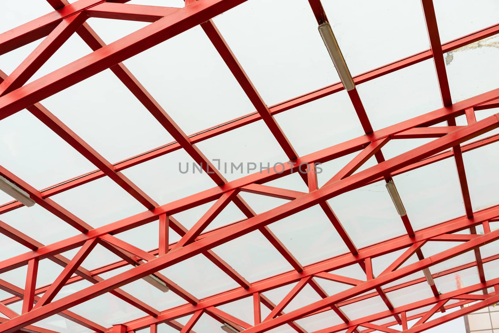 red metal construction holds a transparent roof by Serhii_Voroshchuk