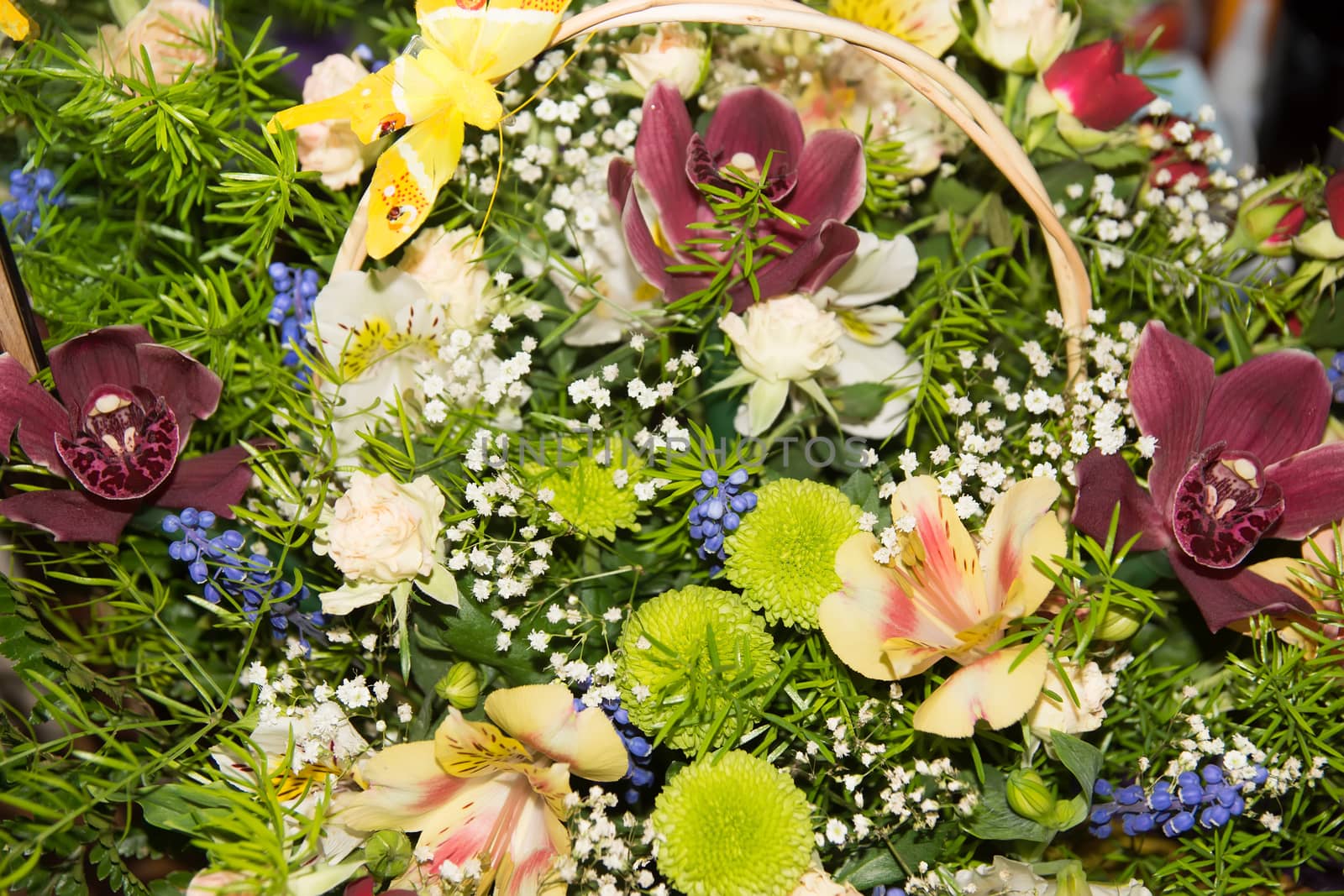 colorful bouquet of fresh flowers in basket by Serhii_Voroshchuk