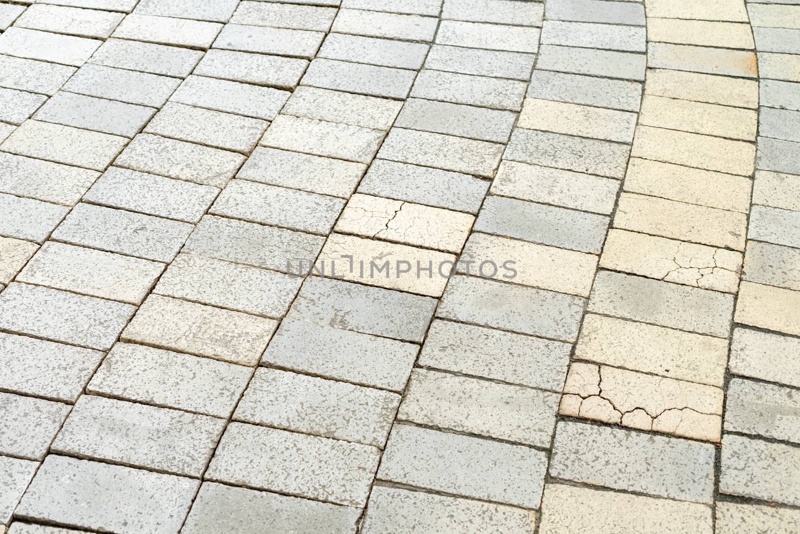 The gray cobblestones are lined with an interesting pattern by Serhii_Voroshchuk