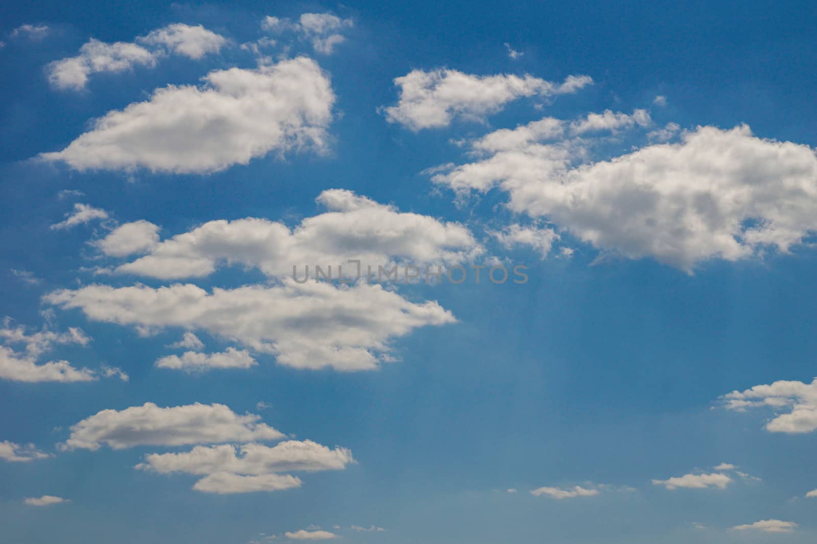 Bright blue sky with white clouds. Sunny day by Serhii_Voroshchuk