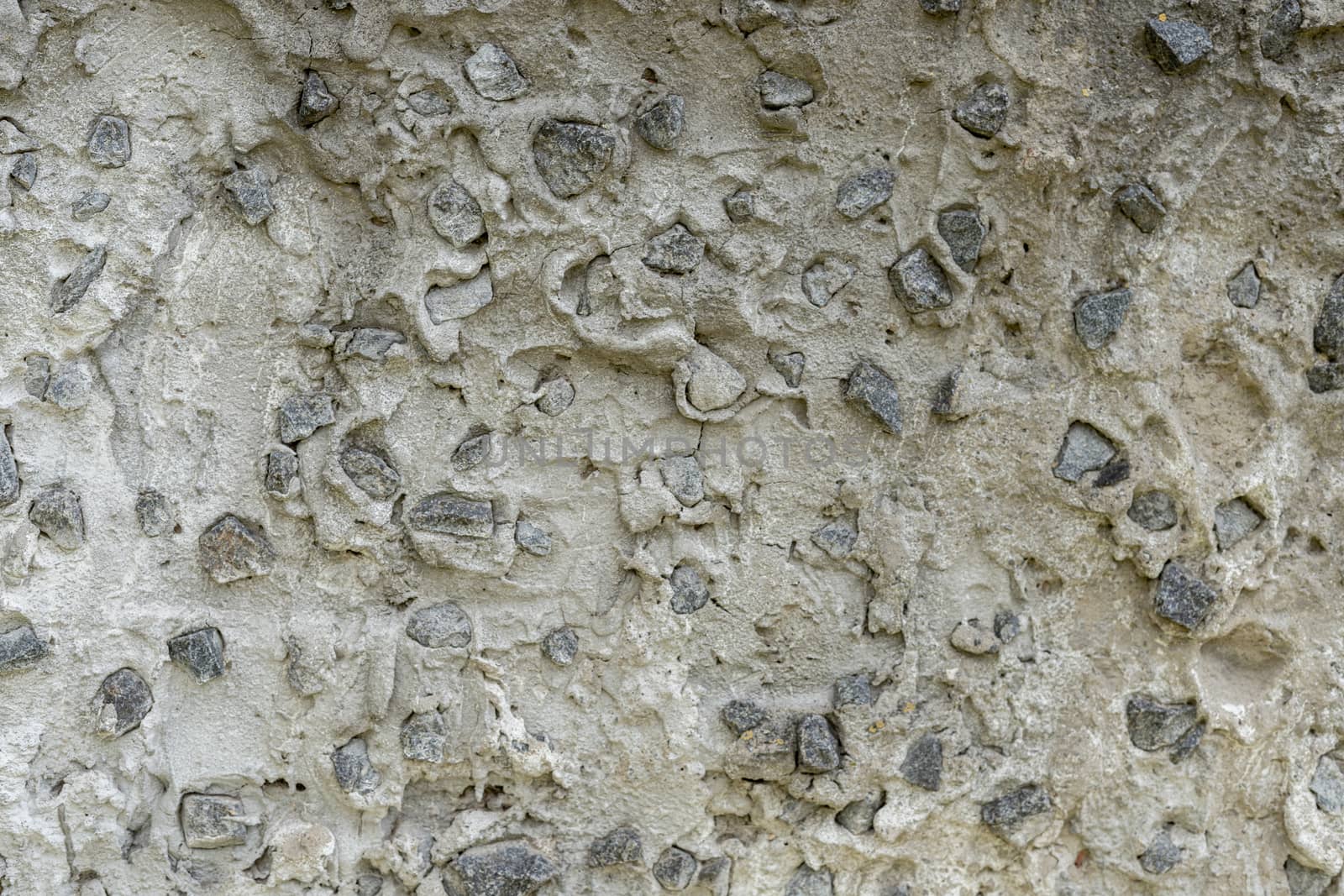 Background: Concrete product made of large granite rubble