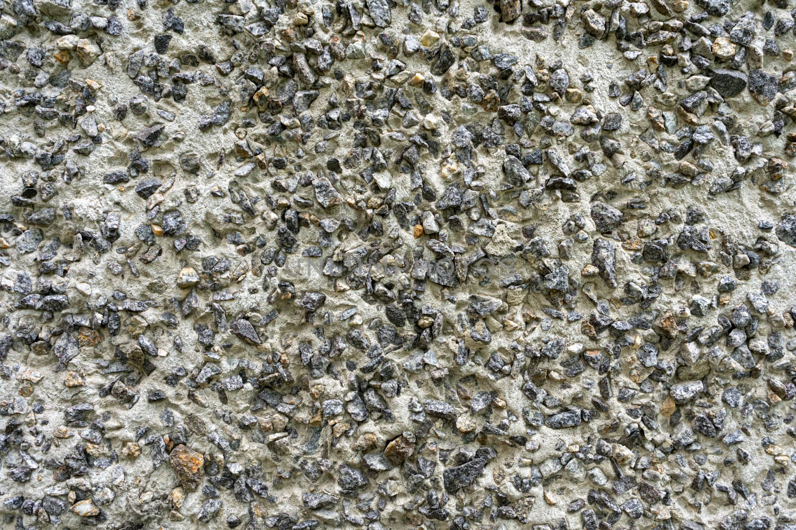 Background: Concrete product made of large granite rubble