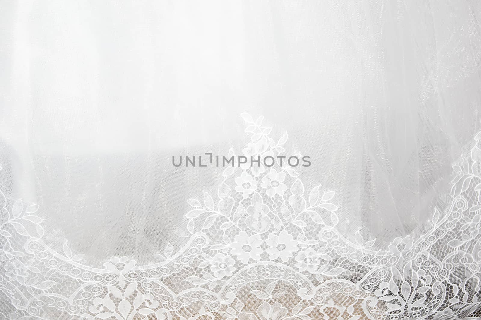 Part of the bride's white dress is decorated with embroidery by Serhii_Voroshchuk