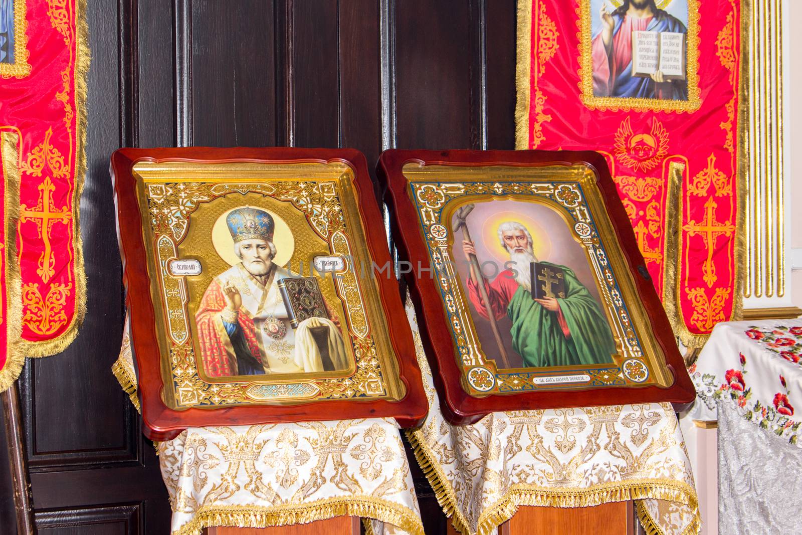 Two icons in beautiful frames stand side by side in the church by Serhii_Voroshchuk