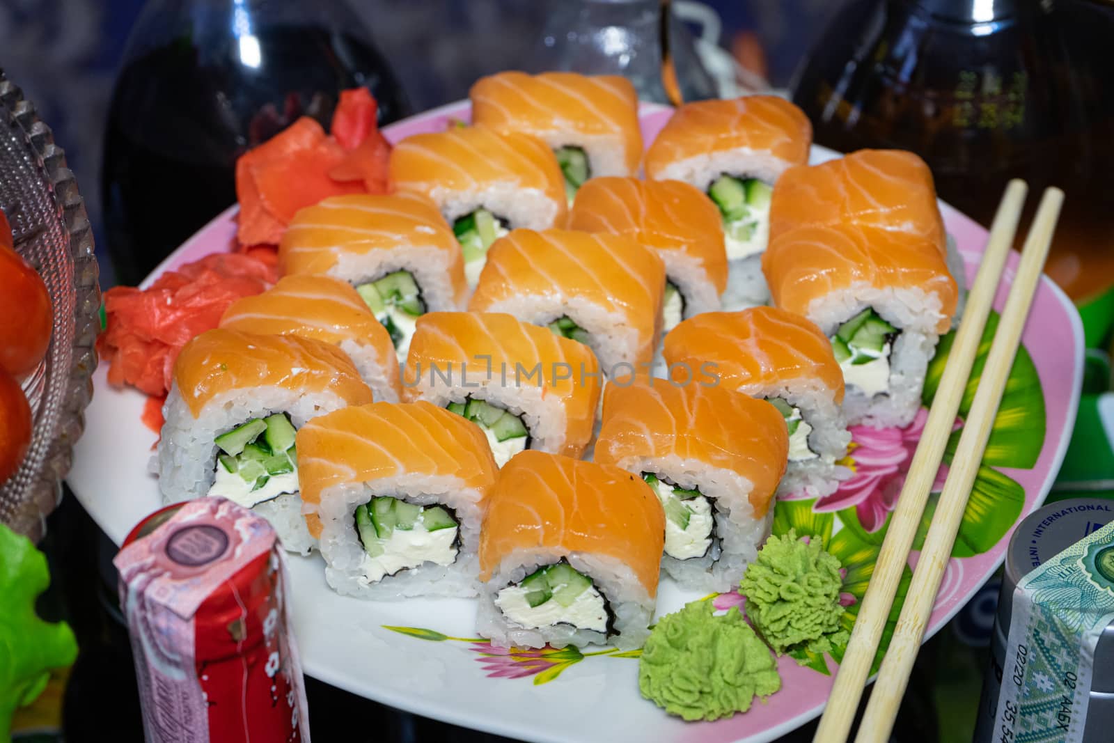 Sushi with red fish. Sushi plate, wasabi and sushi sticks by Serhii_Voroshchuk