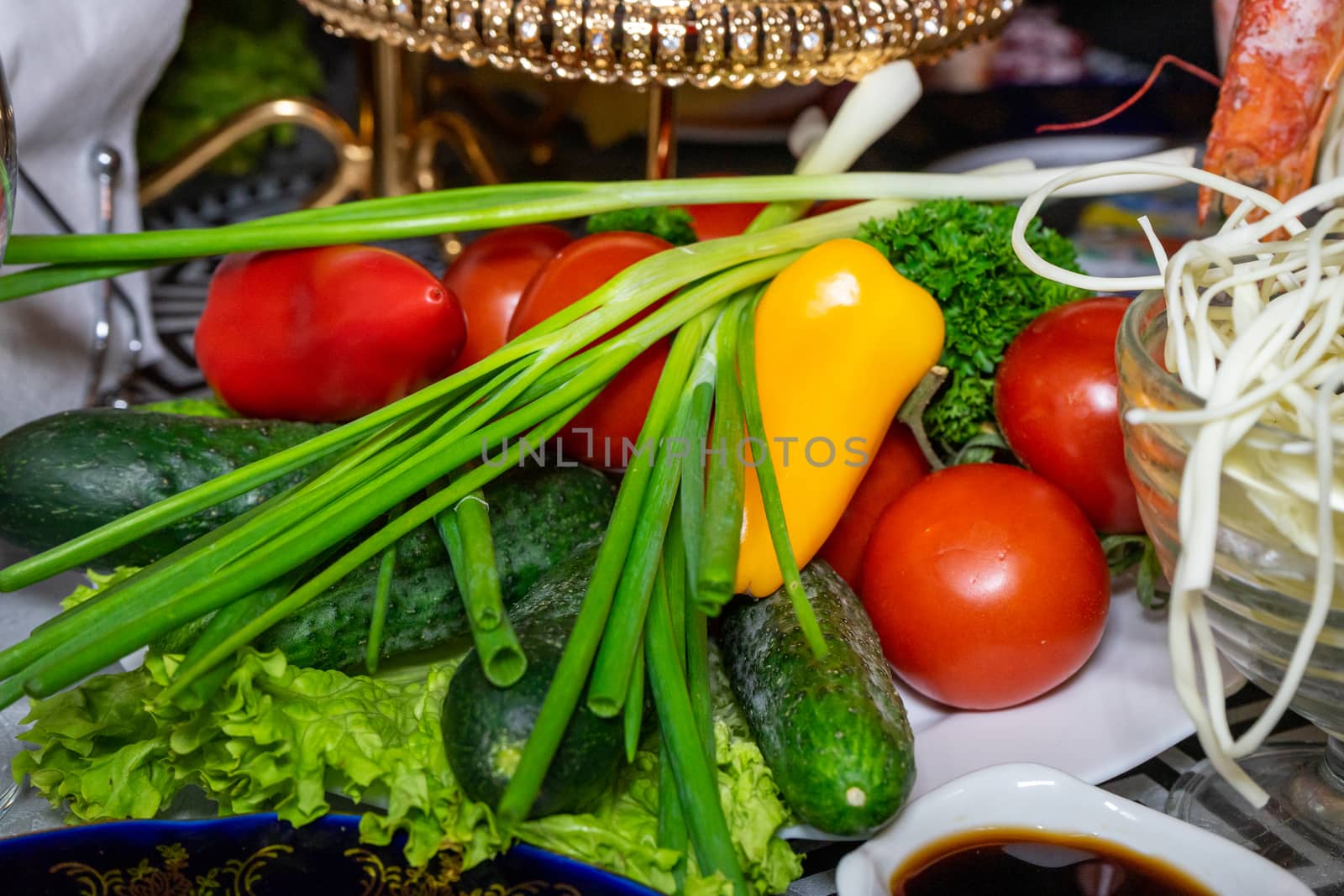 Fresh vegetables on a plate. Vegetarian food. Tomatoes, cucumbers, onions, parsley by Serhii_Voroshchuk