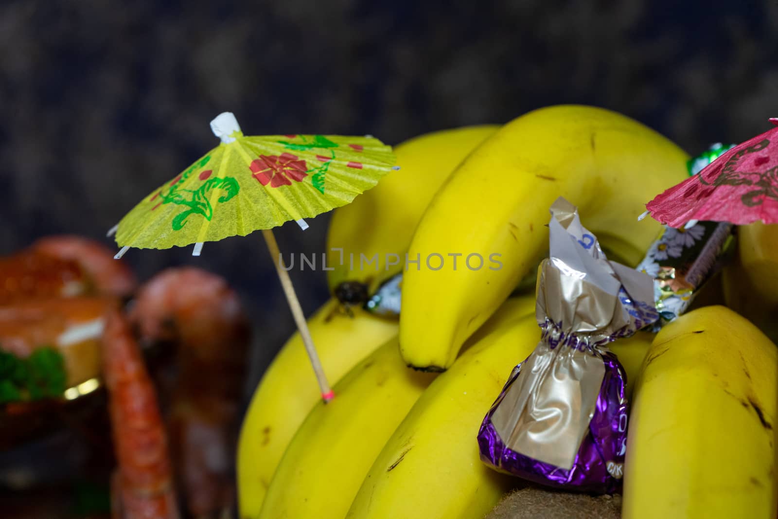 Ukraine, Vinnytsia - May 23, 2020 Banana and candies on a plate. 