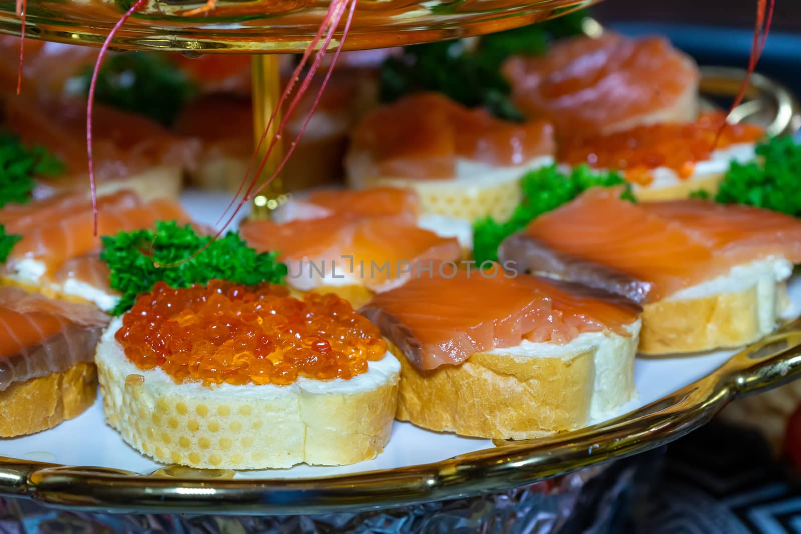 Sandwiches with red fish and red caviar