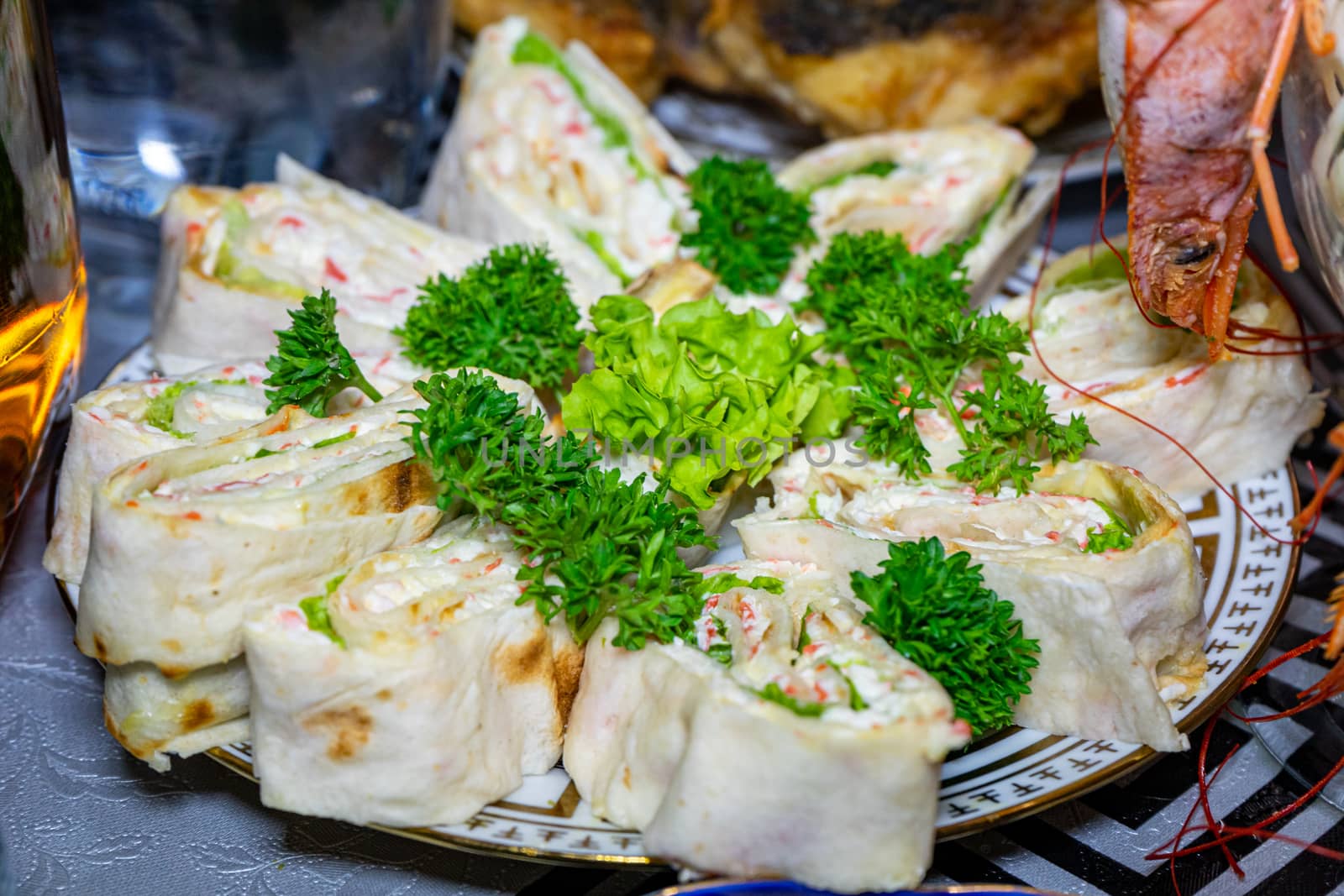 Pita bread with cheese and seafood on a plate decorated with parsley