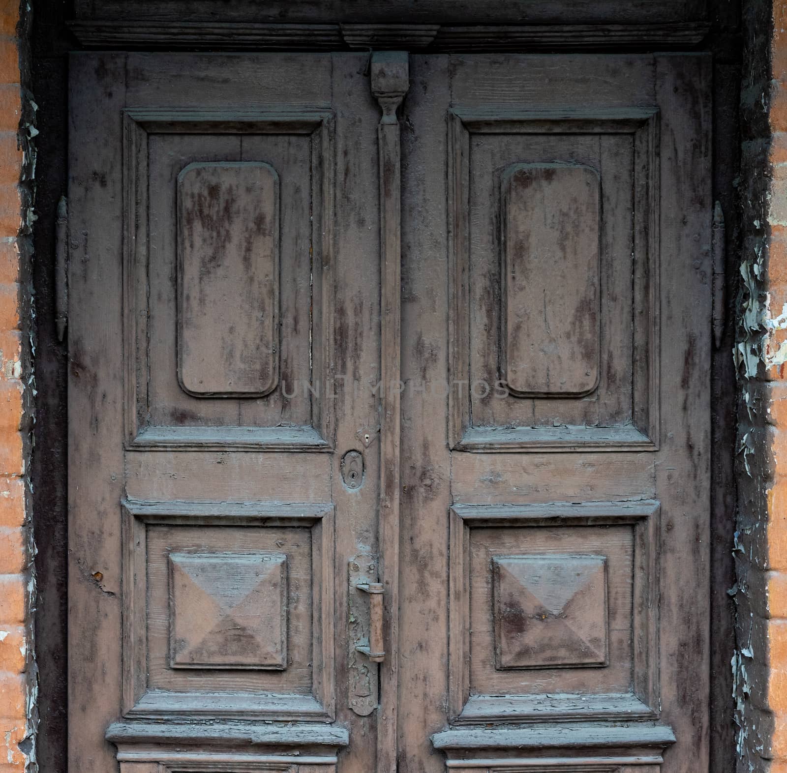 Old wooden doors are painted brown with colorless paint by Serhii_Voroshchuk