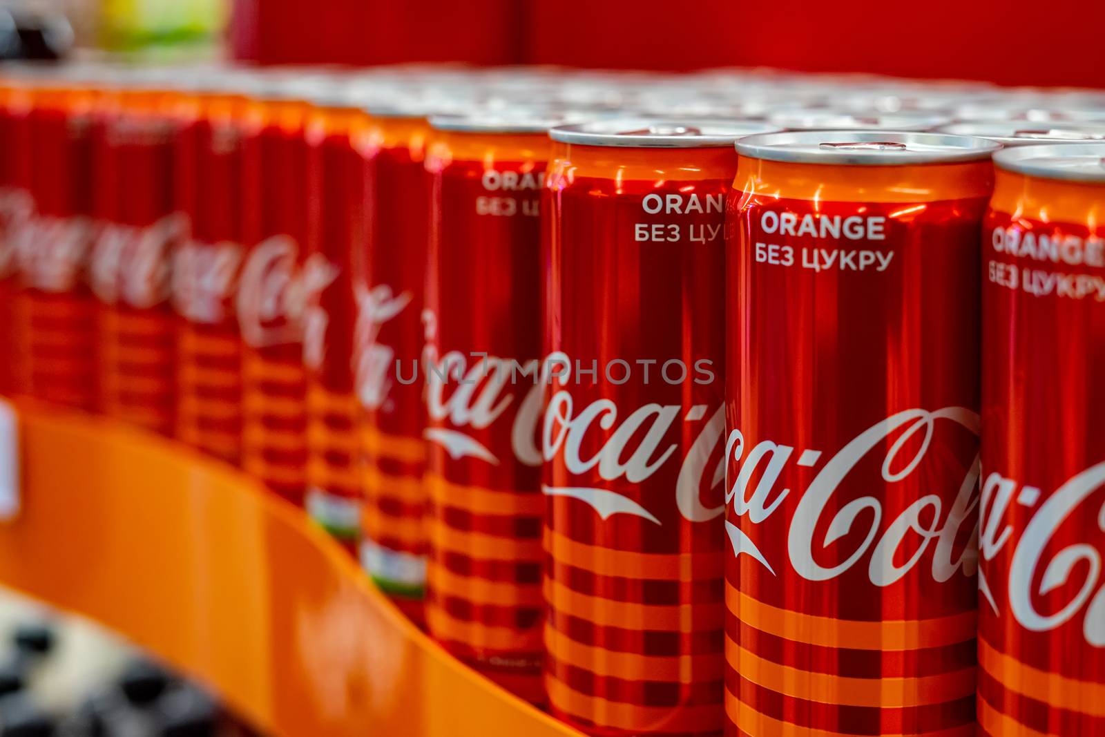 Ukraine, Vinnytsia, 2020 May 25 - Many red iron jars of Coca Cola stand in a shop window by Serhii_Voroshchuk