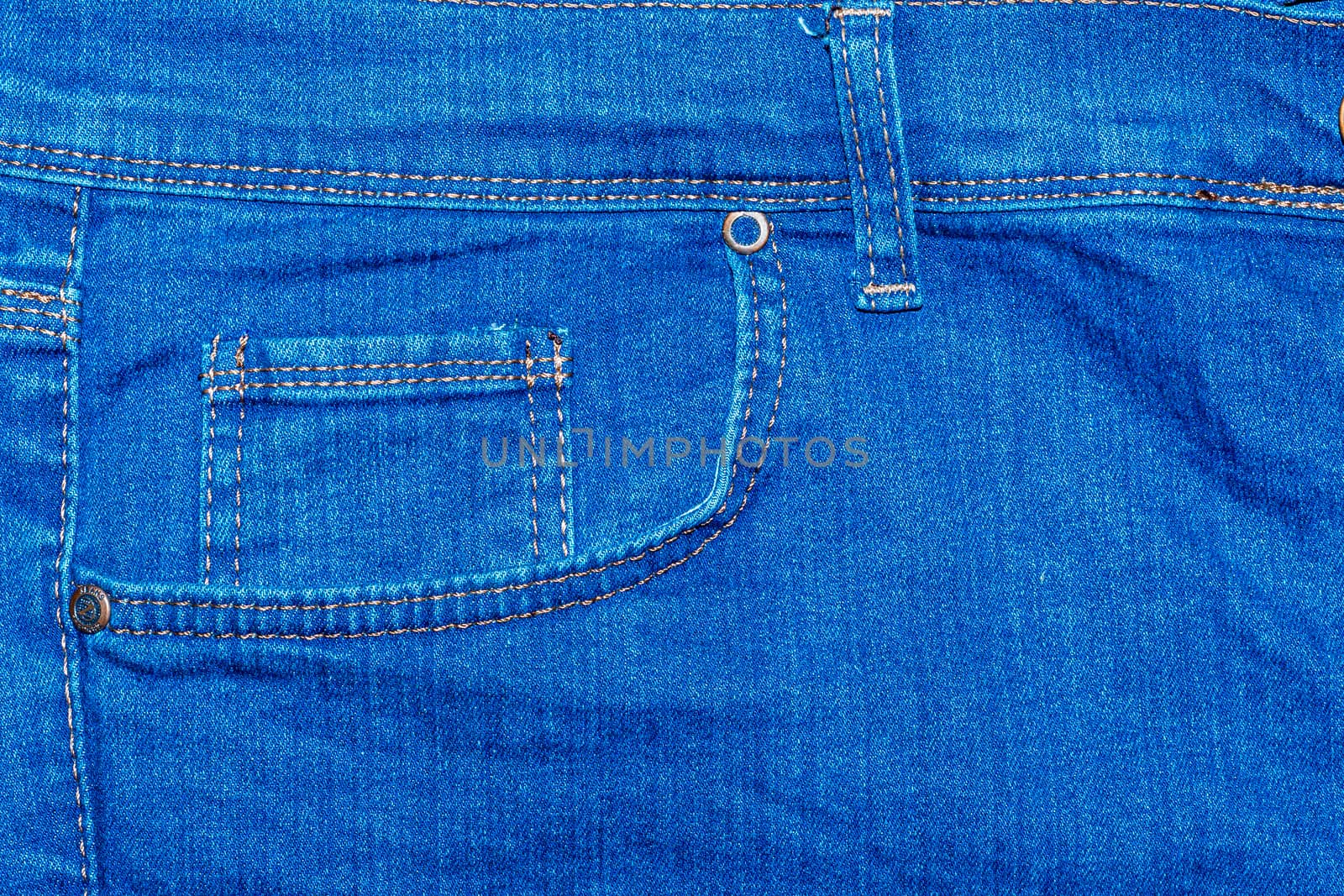 Pocket on denim pants photographed close up