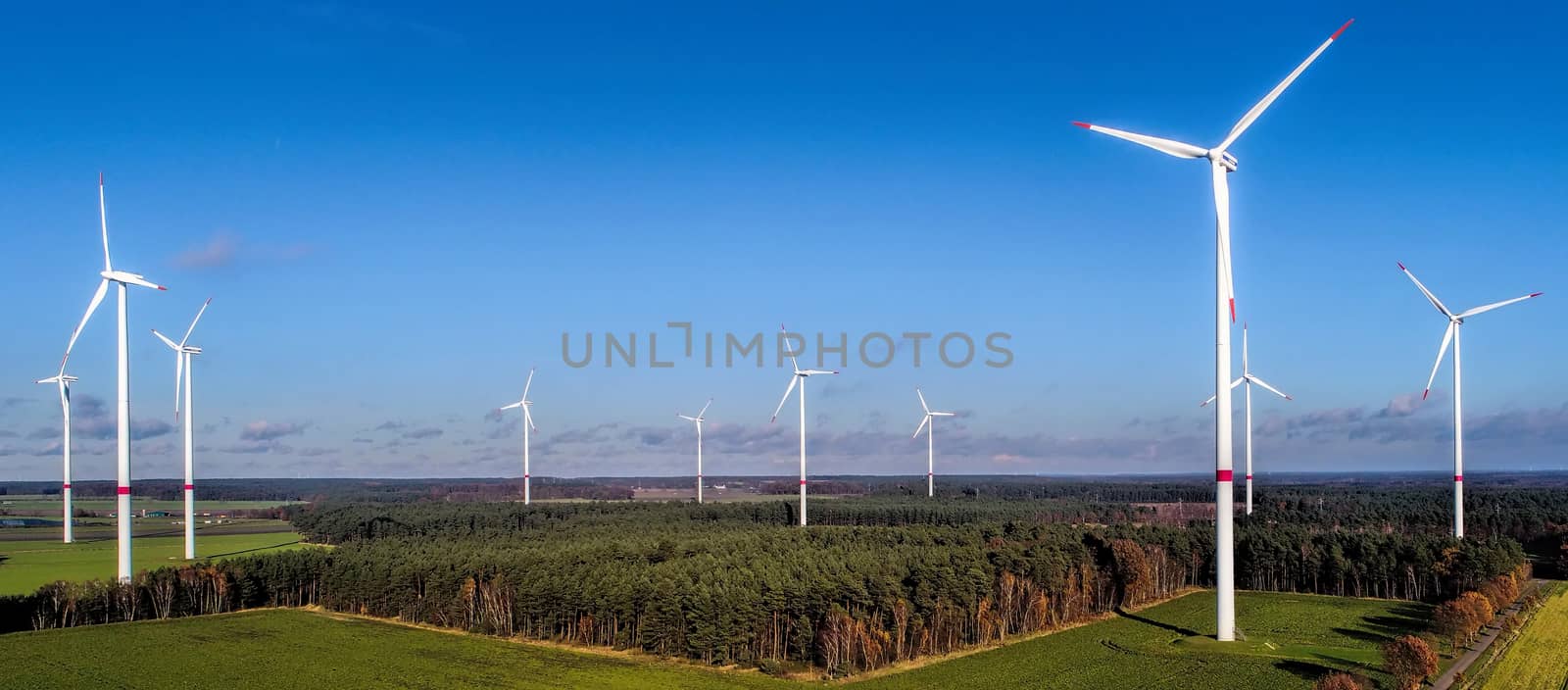 Wind farm in the Heide, aerial view with bright blue sky, near Uelzen, Germany, with plenty of space above