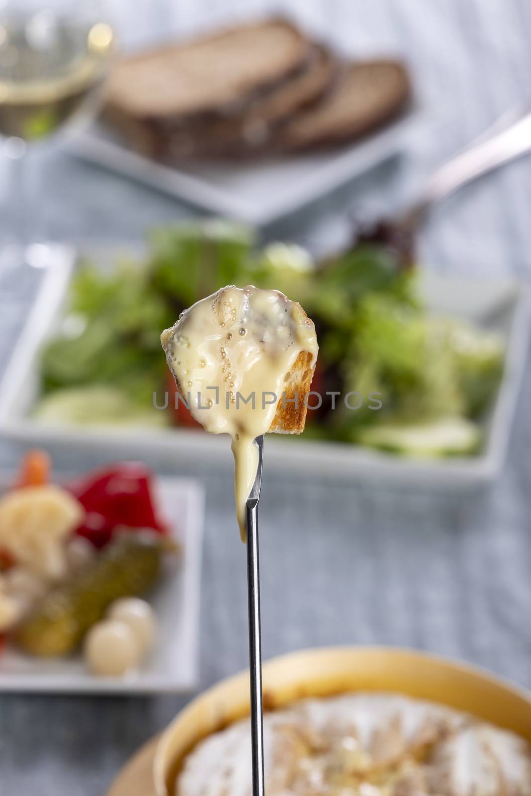 swiss cheese fondue with bread by bernjuer