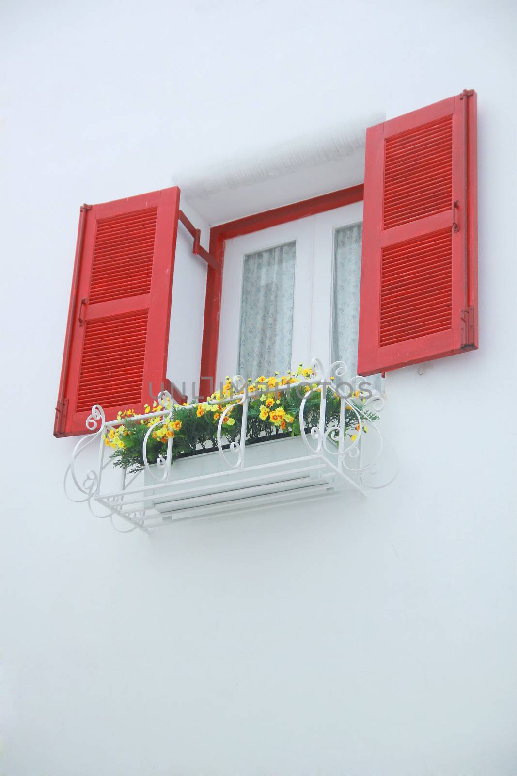 outer opened red and white inner closed window with white wall decorated with flowerpod by asiandelight