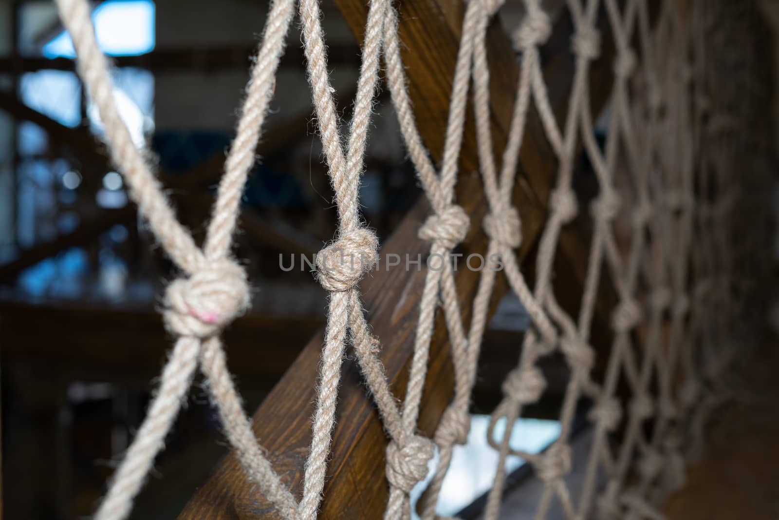 Gray rope net. Large mesh as decoration