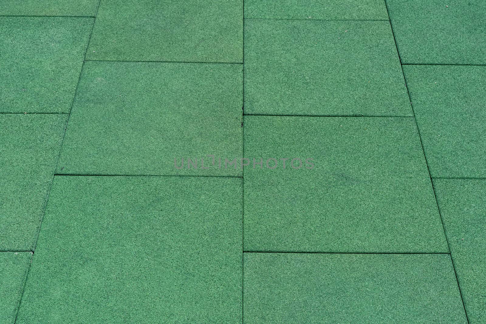 Green tile floor. Floor coverings. Large floor tiles