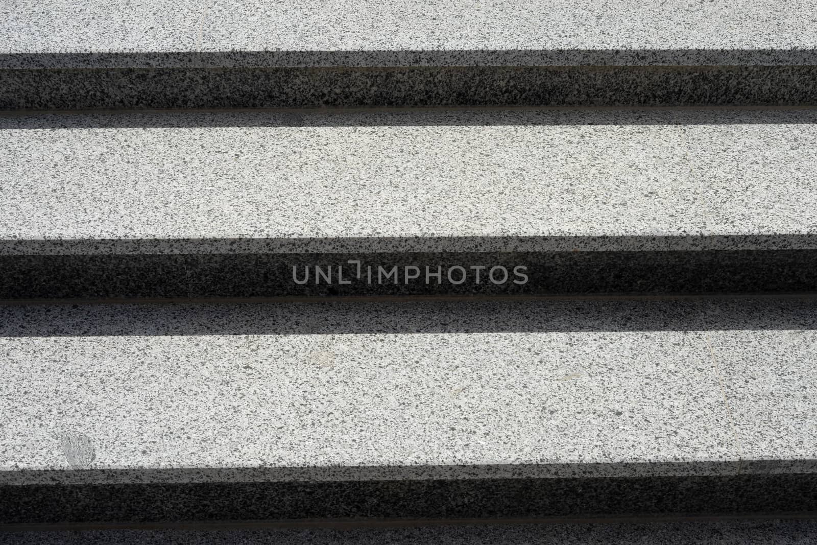 Stairs made of gray granite. Horizontal background. Stairs close up