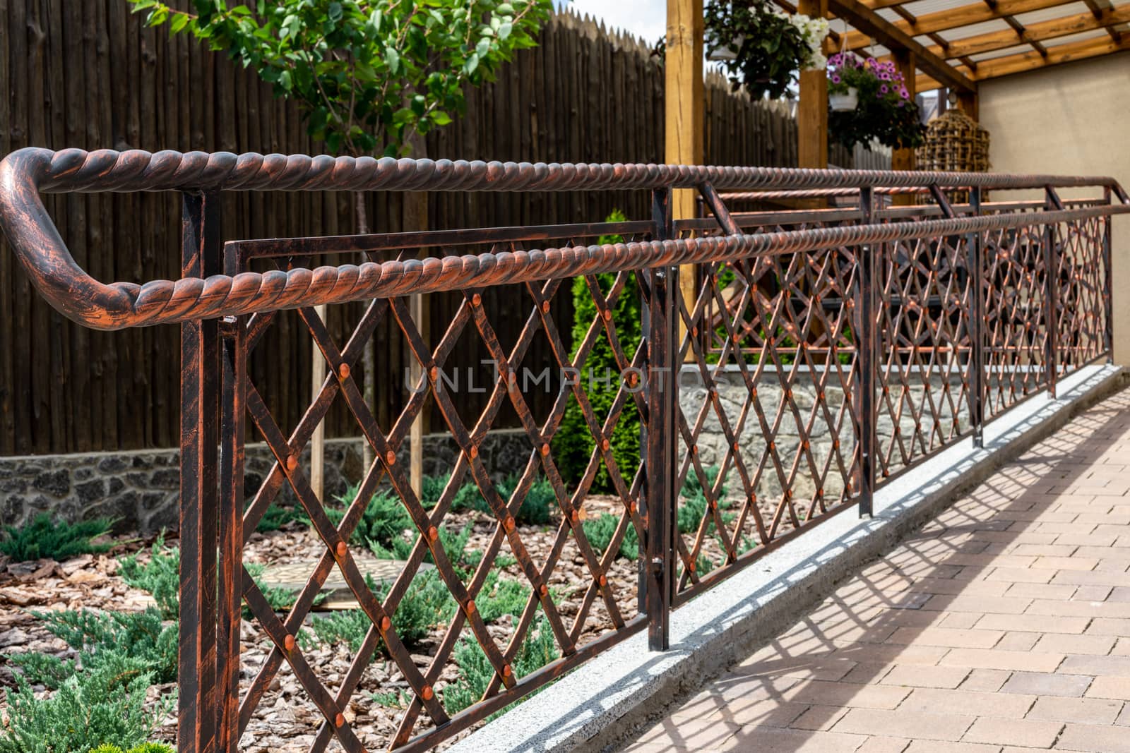 Forged metal products. Antique styling. Iron fence with mesh