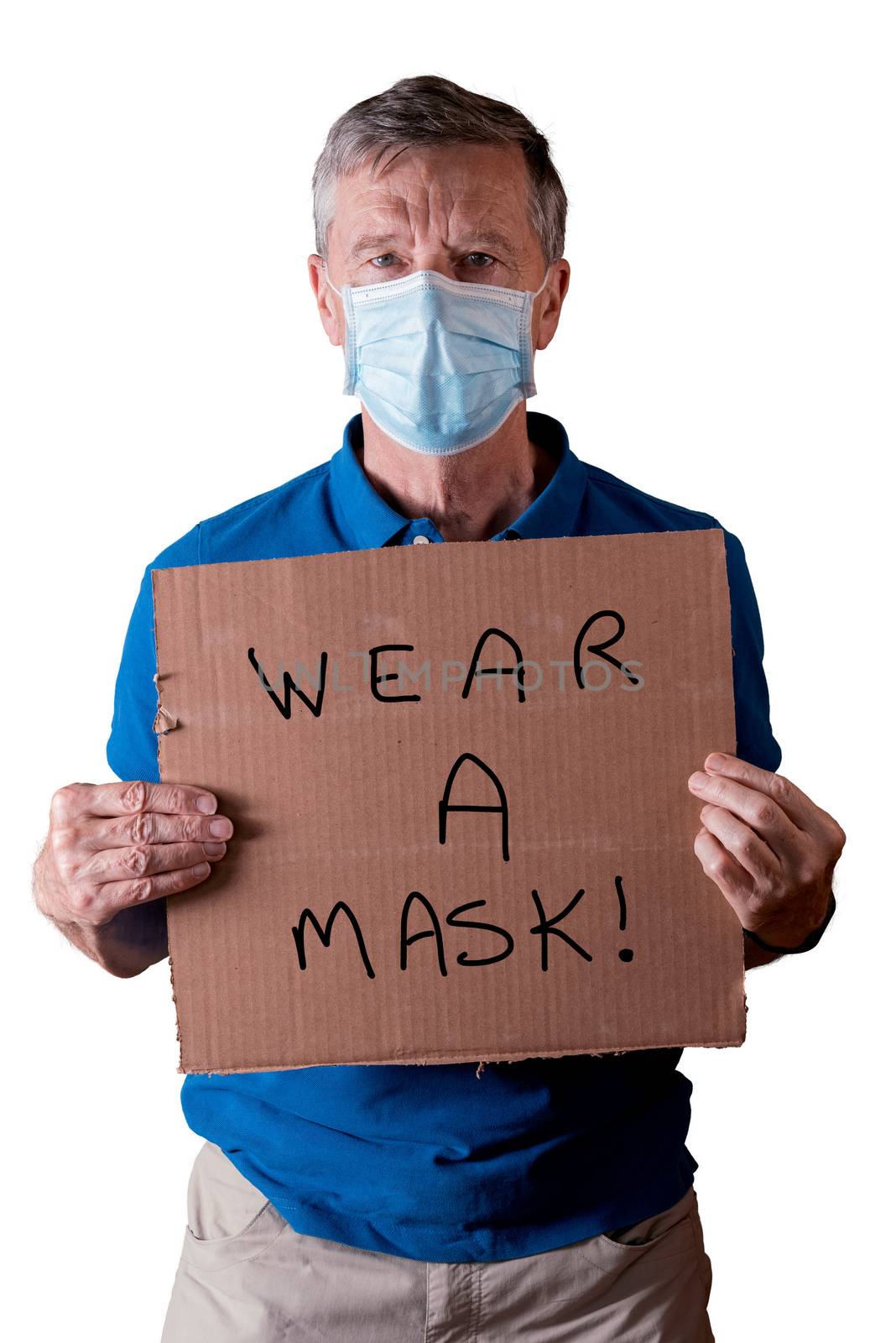 Senior man with face mask holding a cardboard sign with wear a mask message isolated against white by steheap