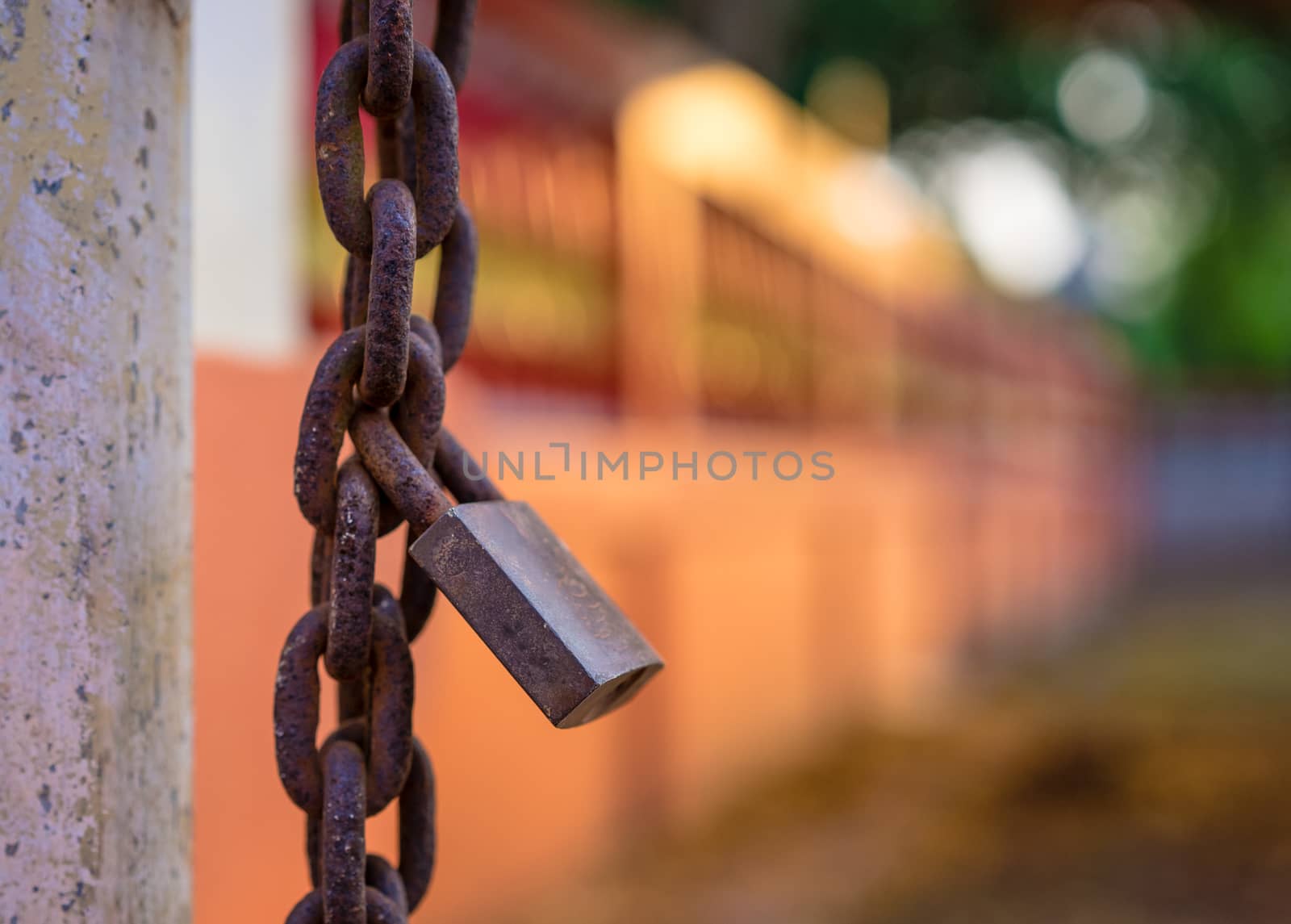 Old rusty padlock and chain on the door