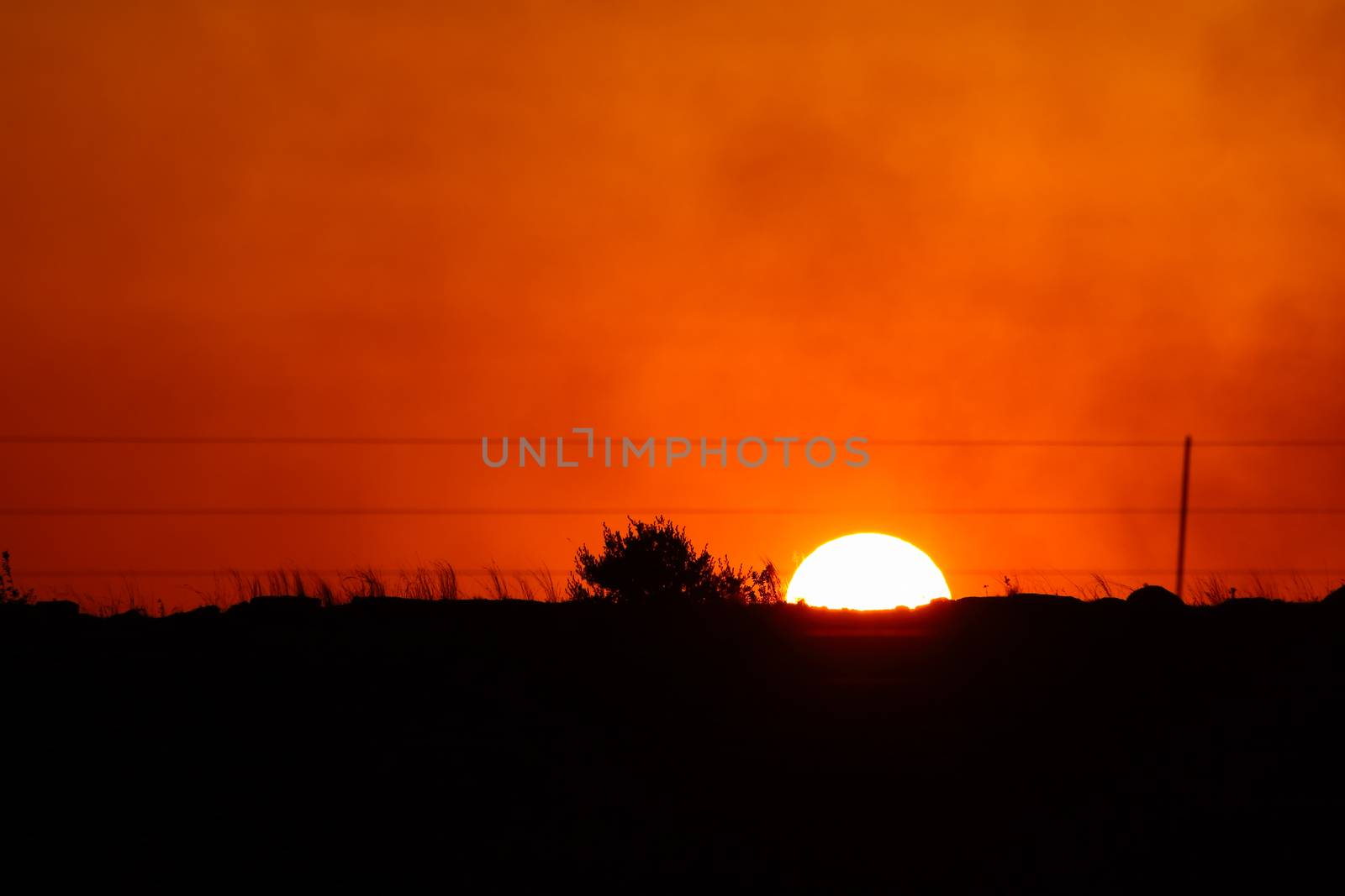 Cloudy orange sunset over a countryside horizon, Pretoria, South Africa