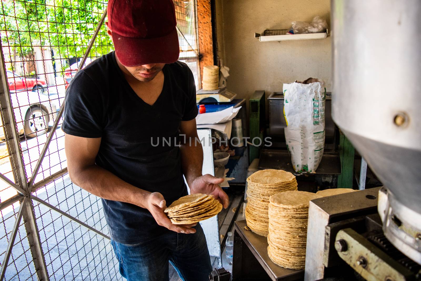young man selling tortillas of nixtamal by Tonhio