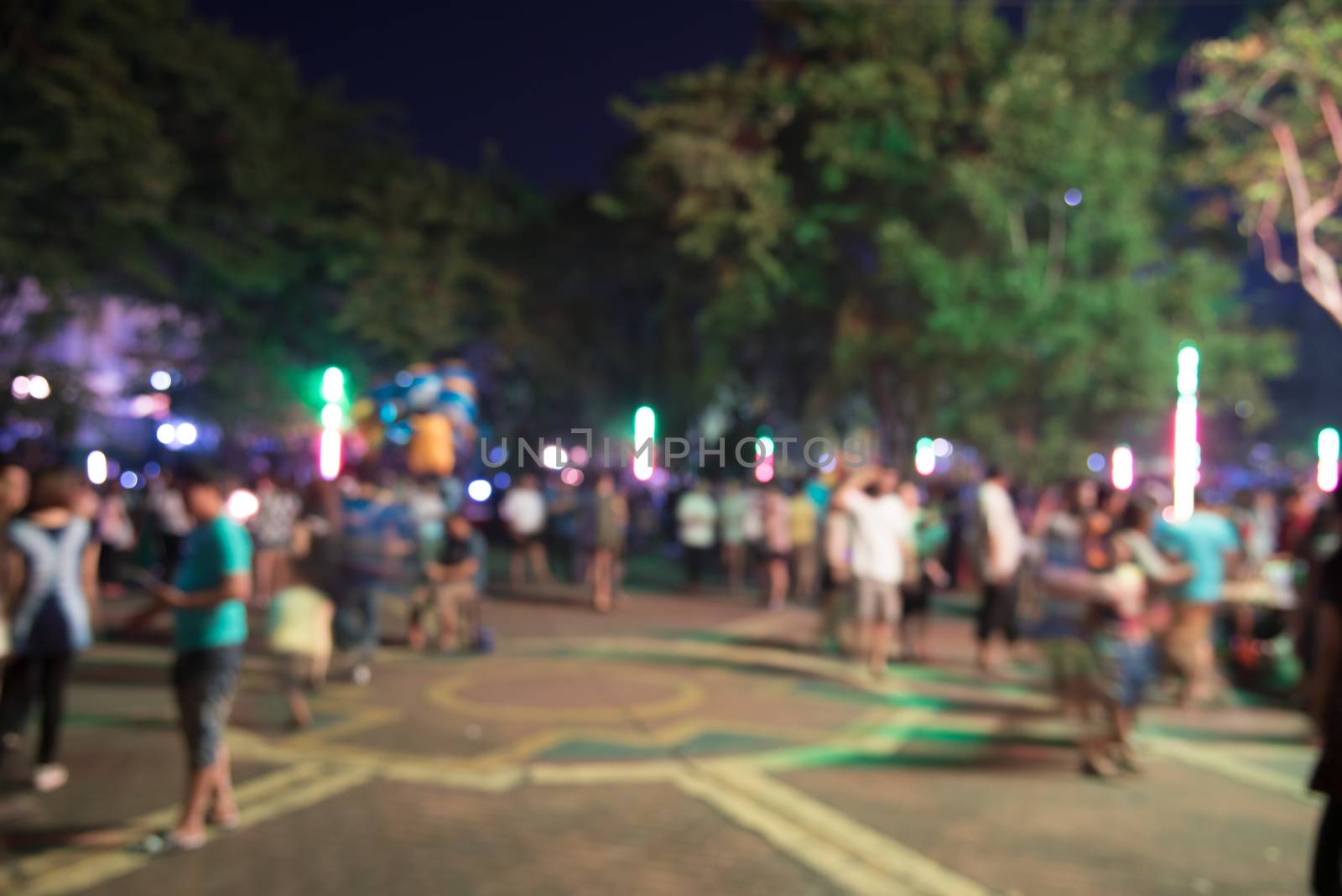 abstract blurred people at night market  festival