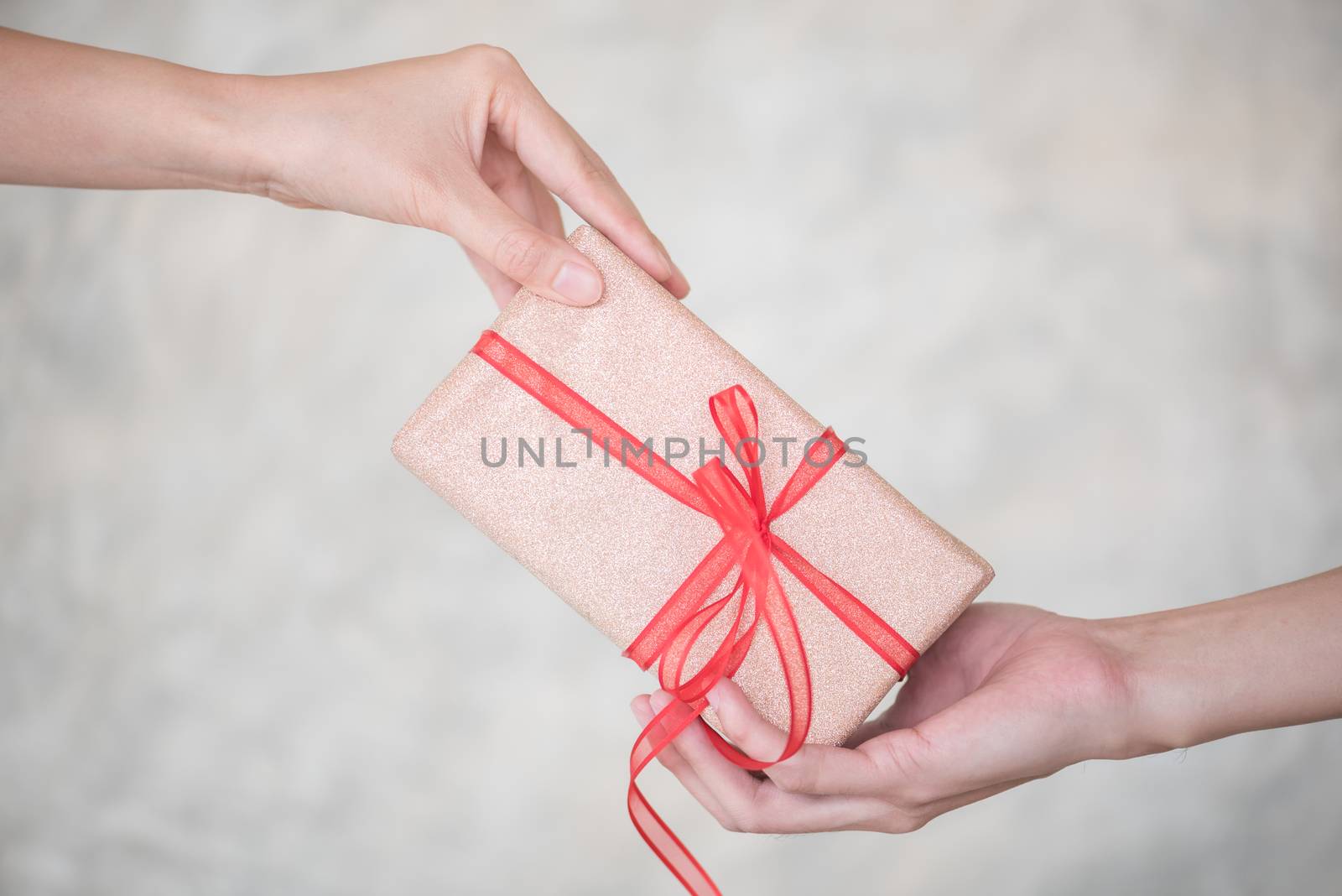 woman hand giving giftbox