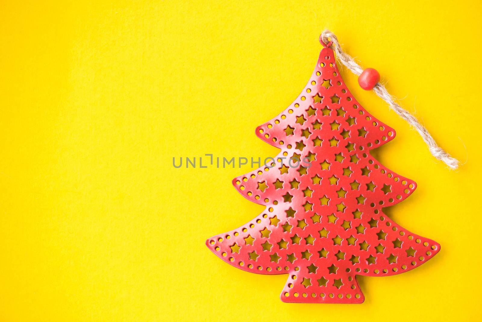 red star christmas tree on yellow paper background