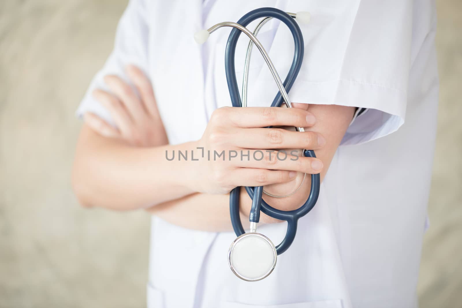 confidential woman doctor with green stethoscope in hand